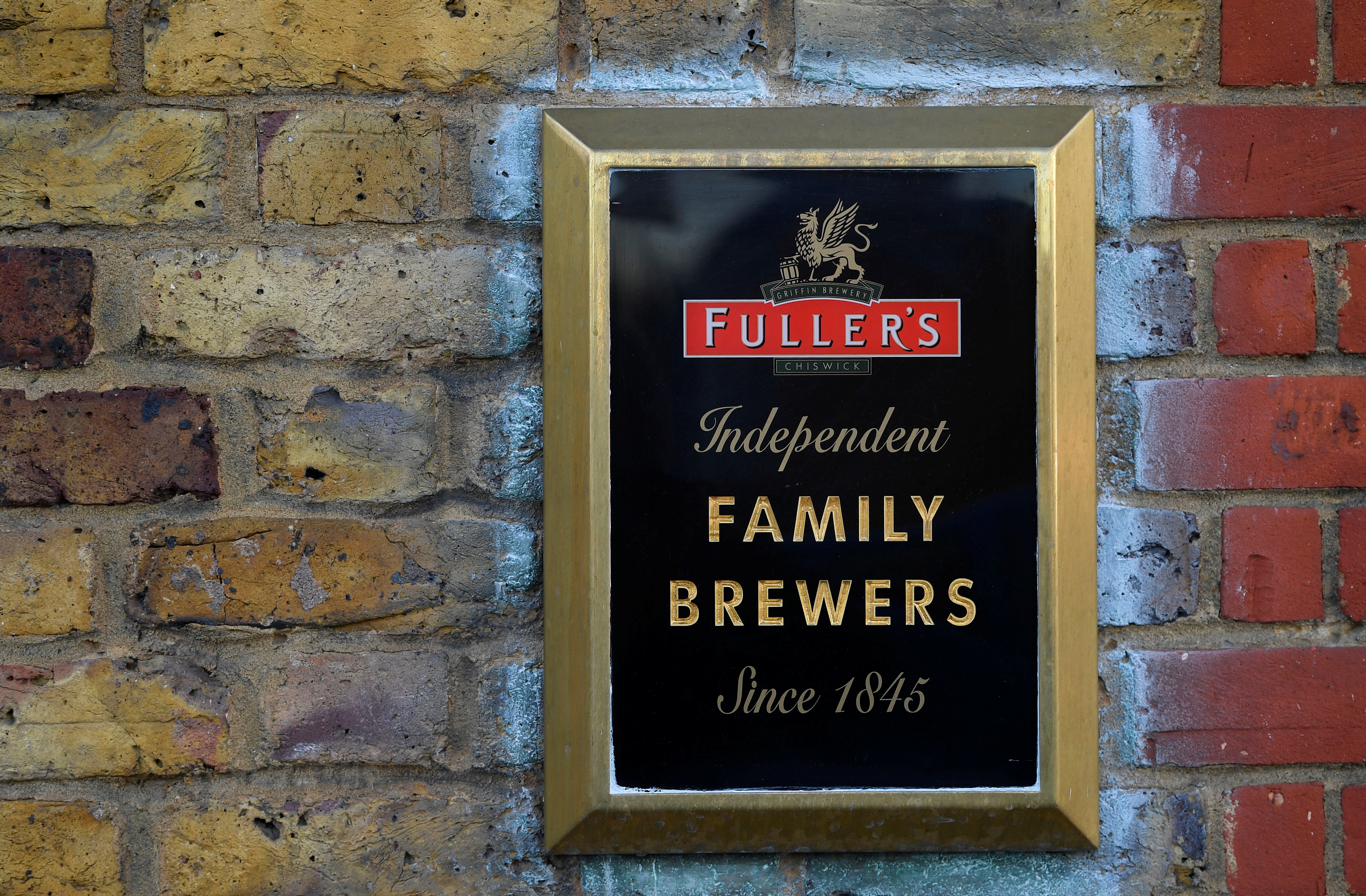 Signage is seen outside of a Fuller's pub in Chiswick, London, Britain