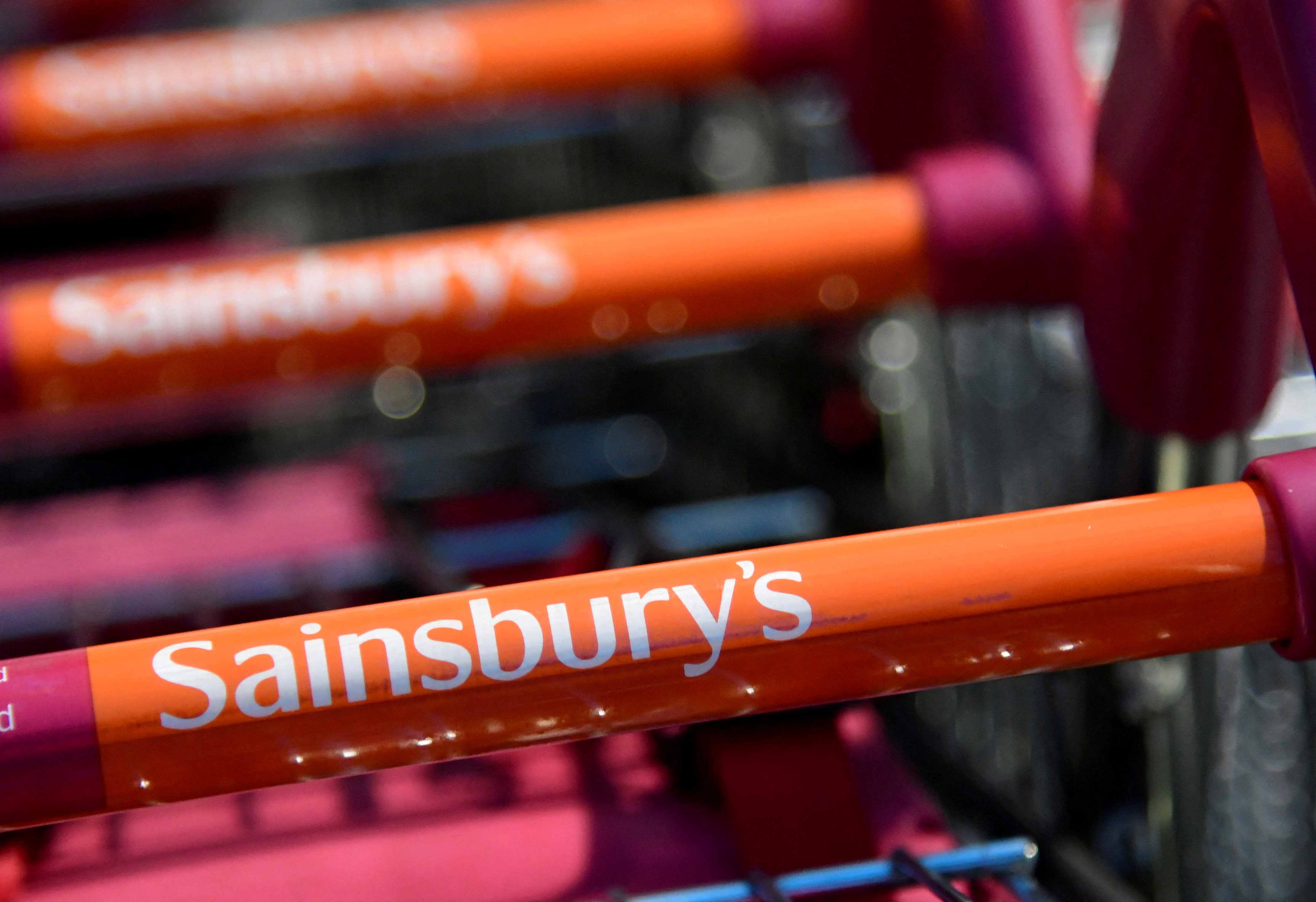 Branding is seen on a shopping trolley at a branch of the Sainsbury's supermarket in London