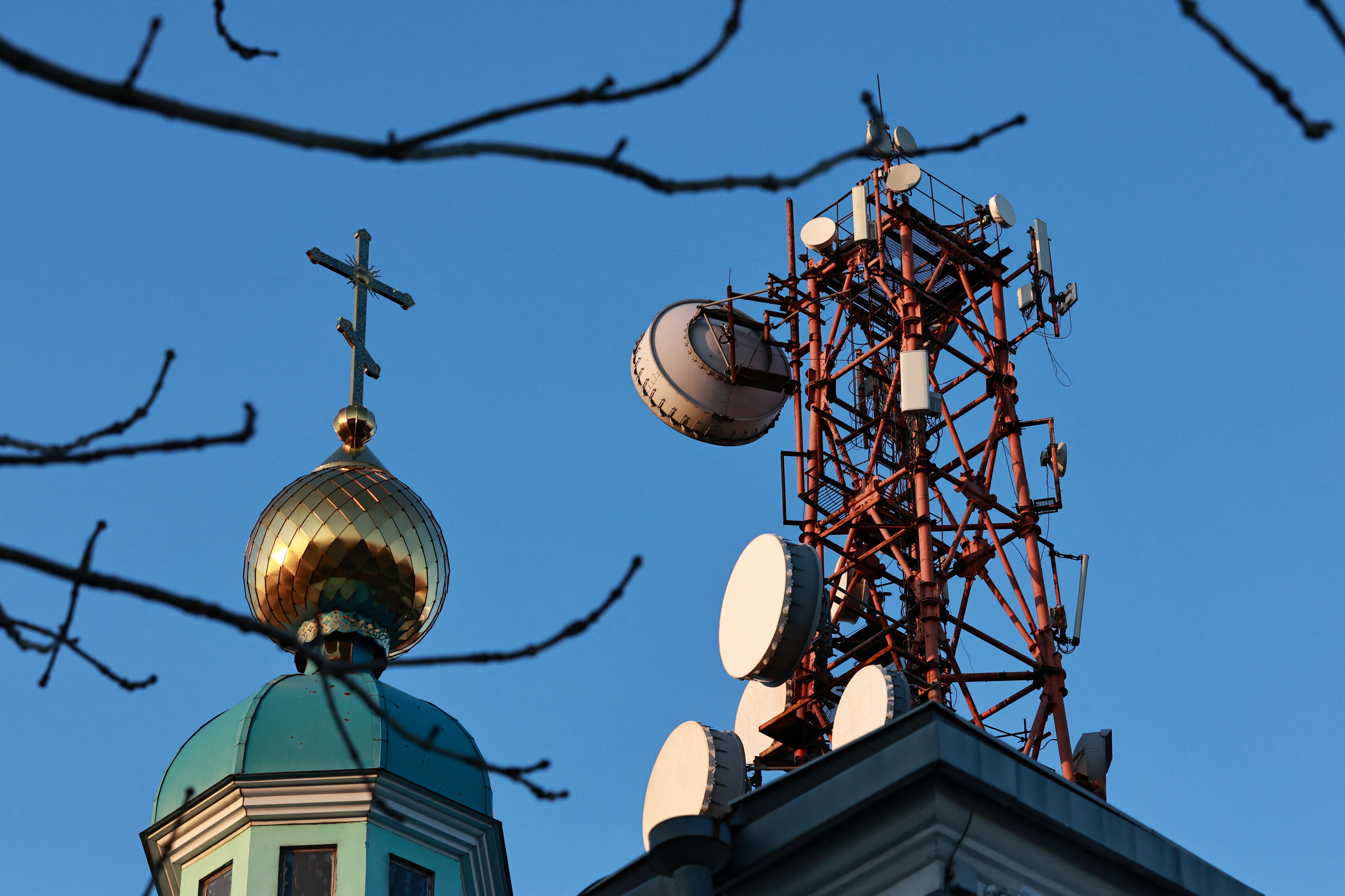 A view shows a communication tower next to an Orthodox church in Vladivostok