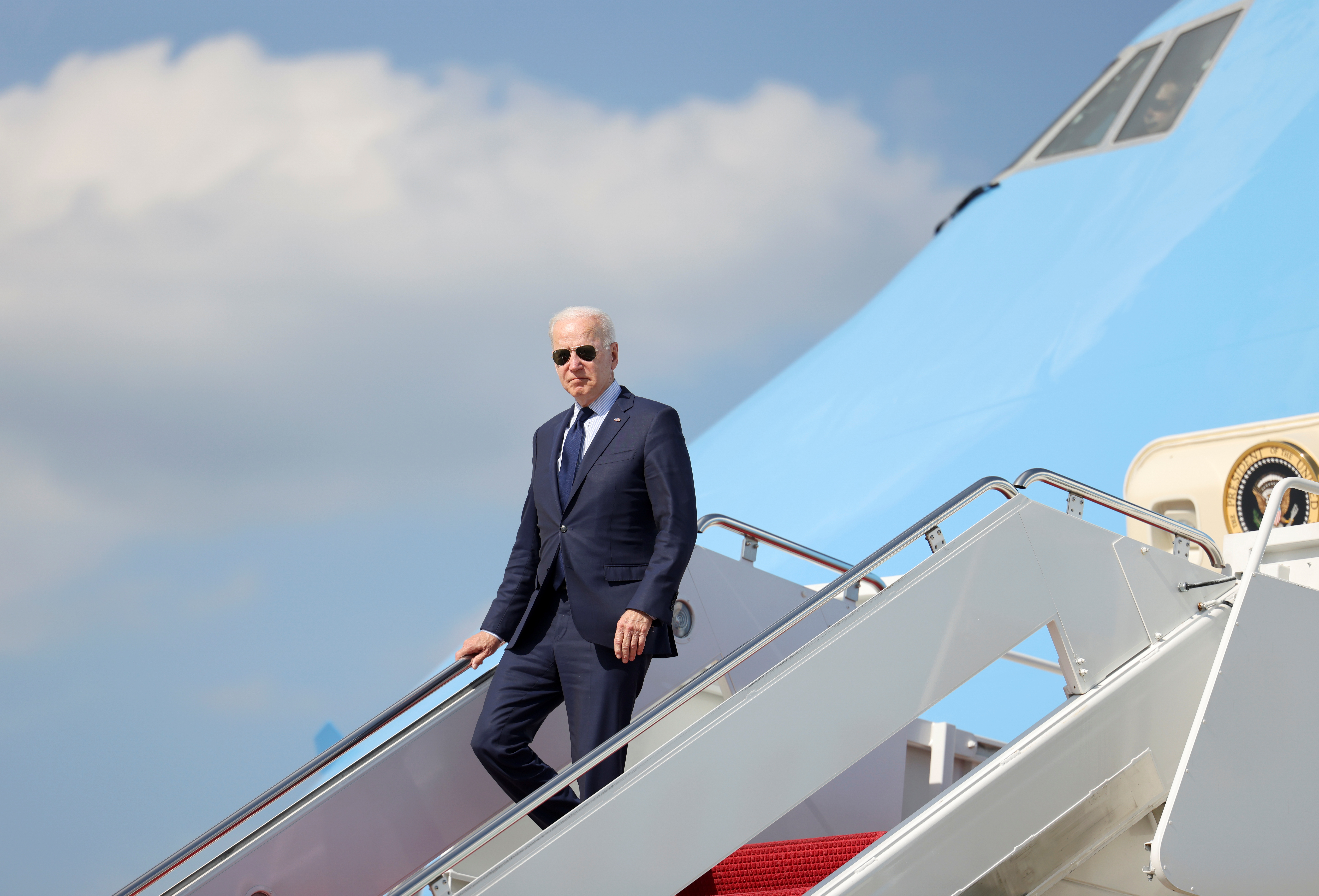U.S. President Joe Biden disembarks from Air Force One after landing at Joint Base Andrews