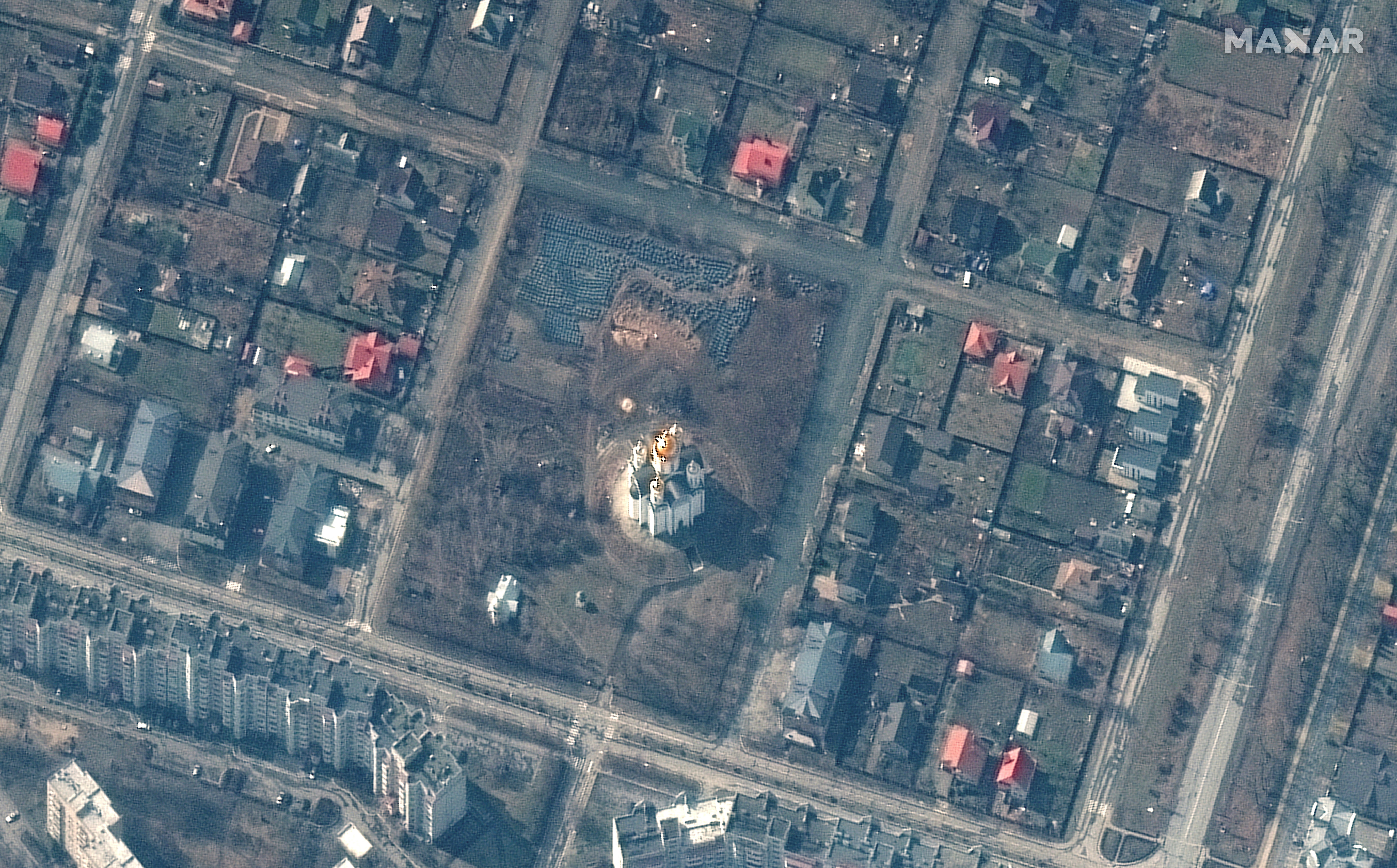 A satellite image shows the grave site near the Church of St. Andrew and Pyervozvannoho All Saints, in Bucha