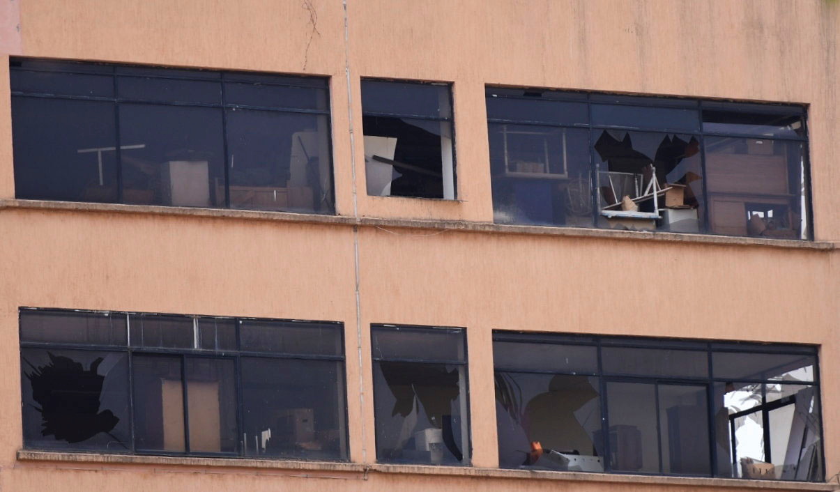 Shuttered windows are seen at a building near the scene of a blast in Kampala
