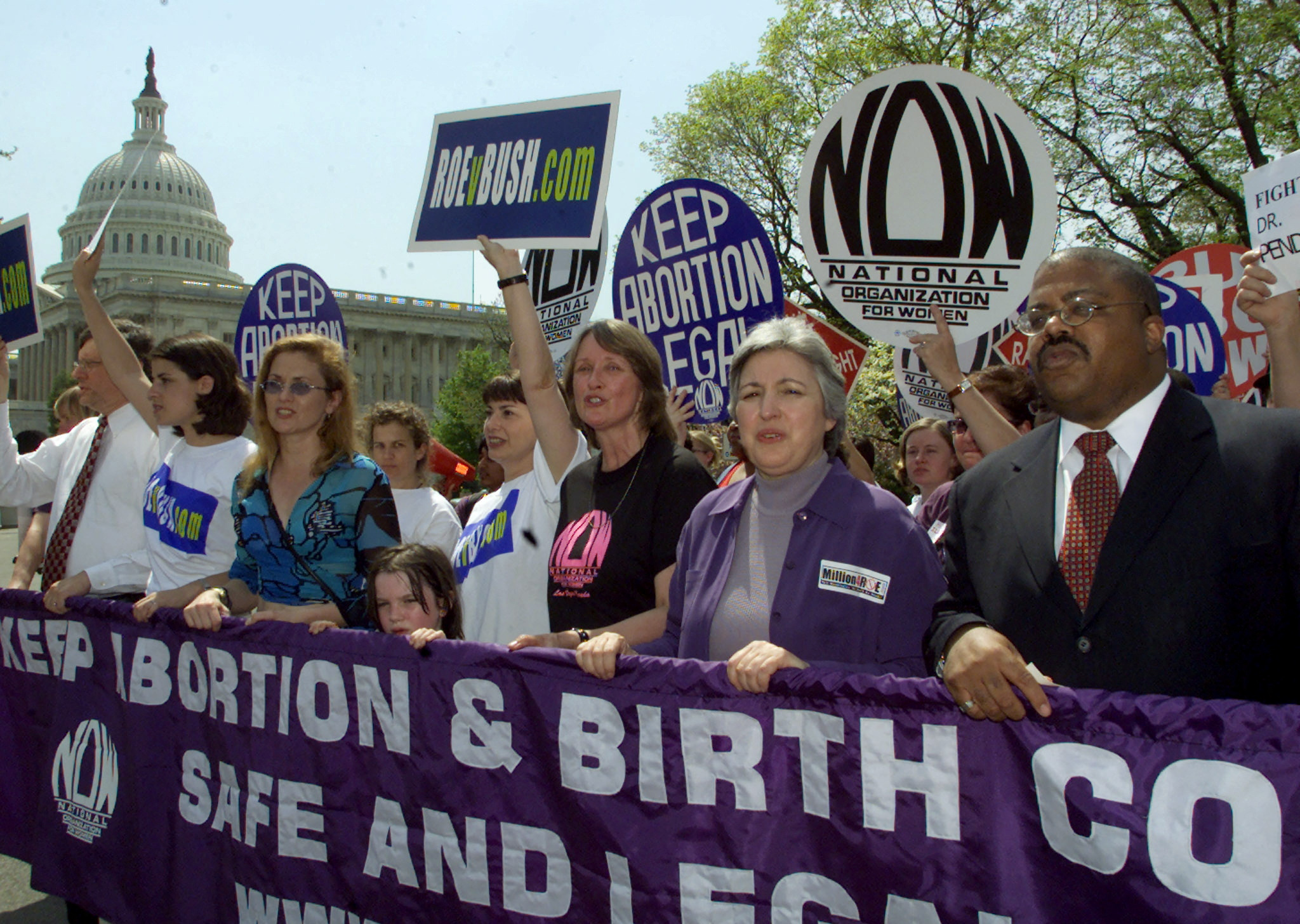 National Organization for Women president Patricia Ireland (C) marches with pro-choice supporters past the U.S. Capitol Building in Washington