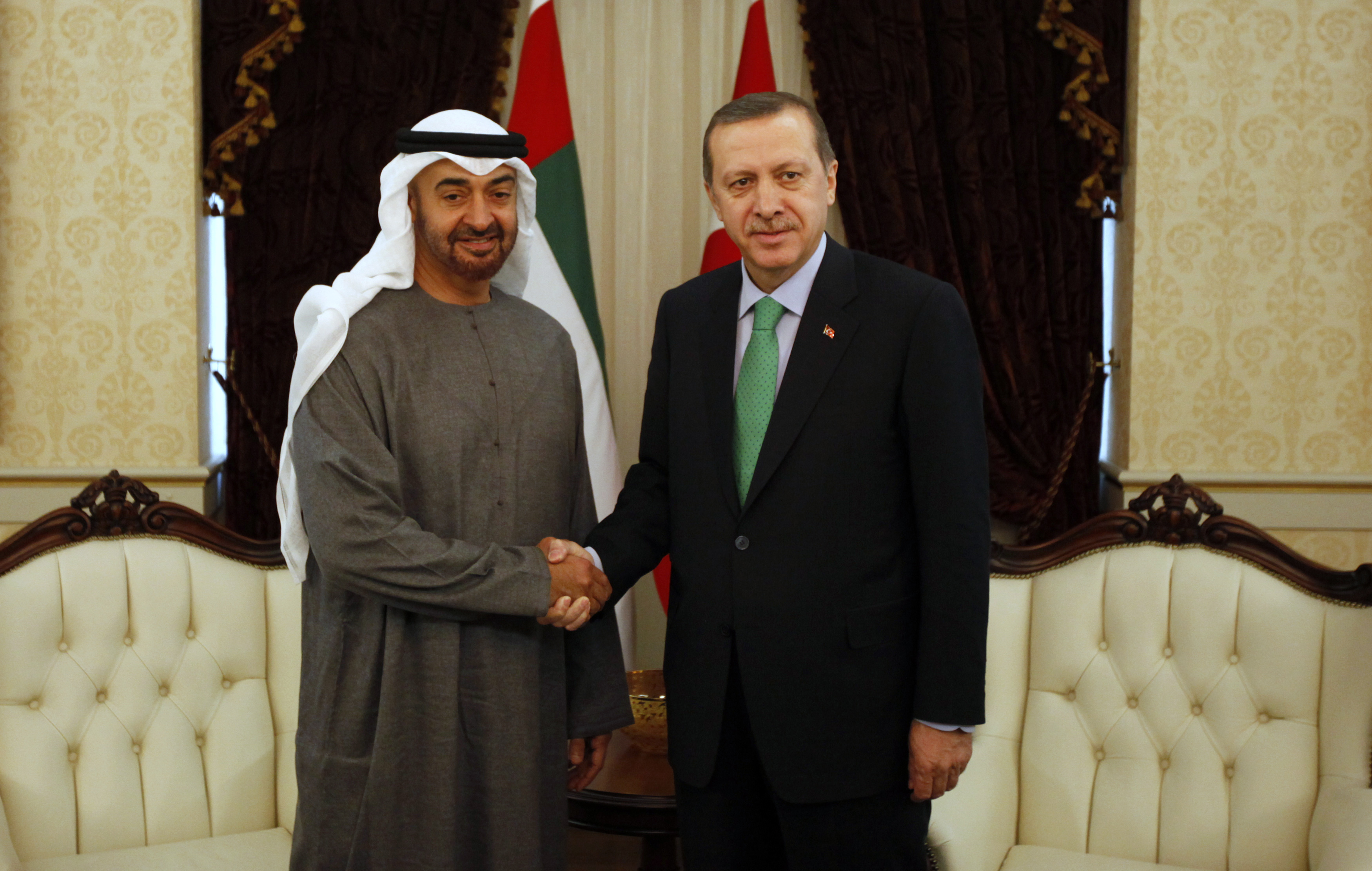 Abu Dhabi's Crown Prince Sheikh Mohammed shakes hands with Turkey's PM Erdogan before a meeting in Ankara