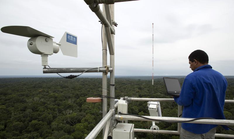 A worker monitors the Amazon Tall Tower Observatory (ATTO) in Sao Sebastiao do Uatuma