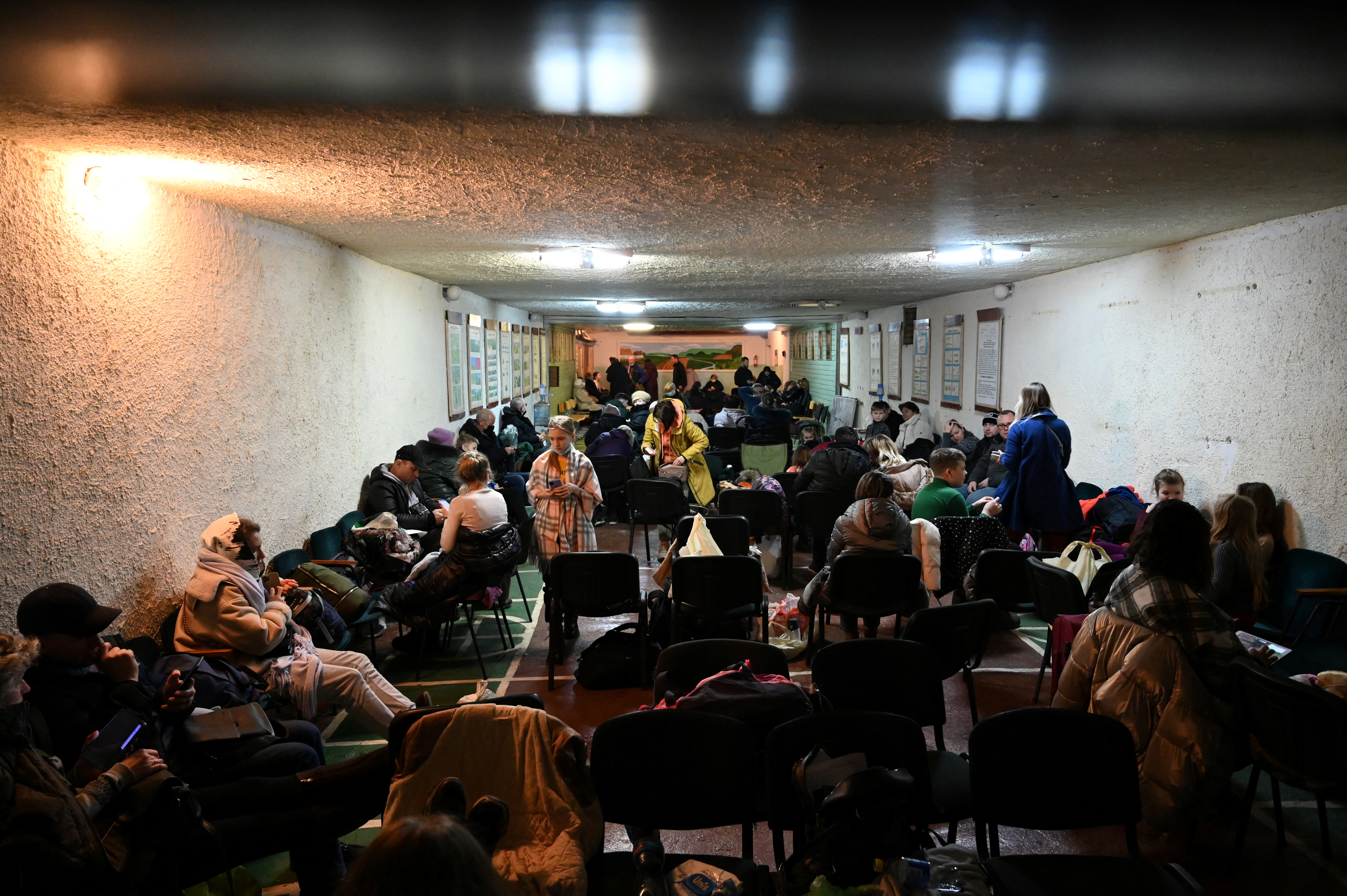 People gather in an air raid shelter in Kyiv