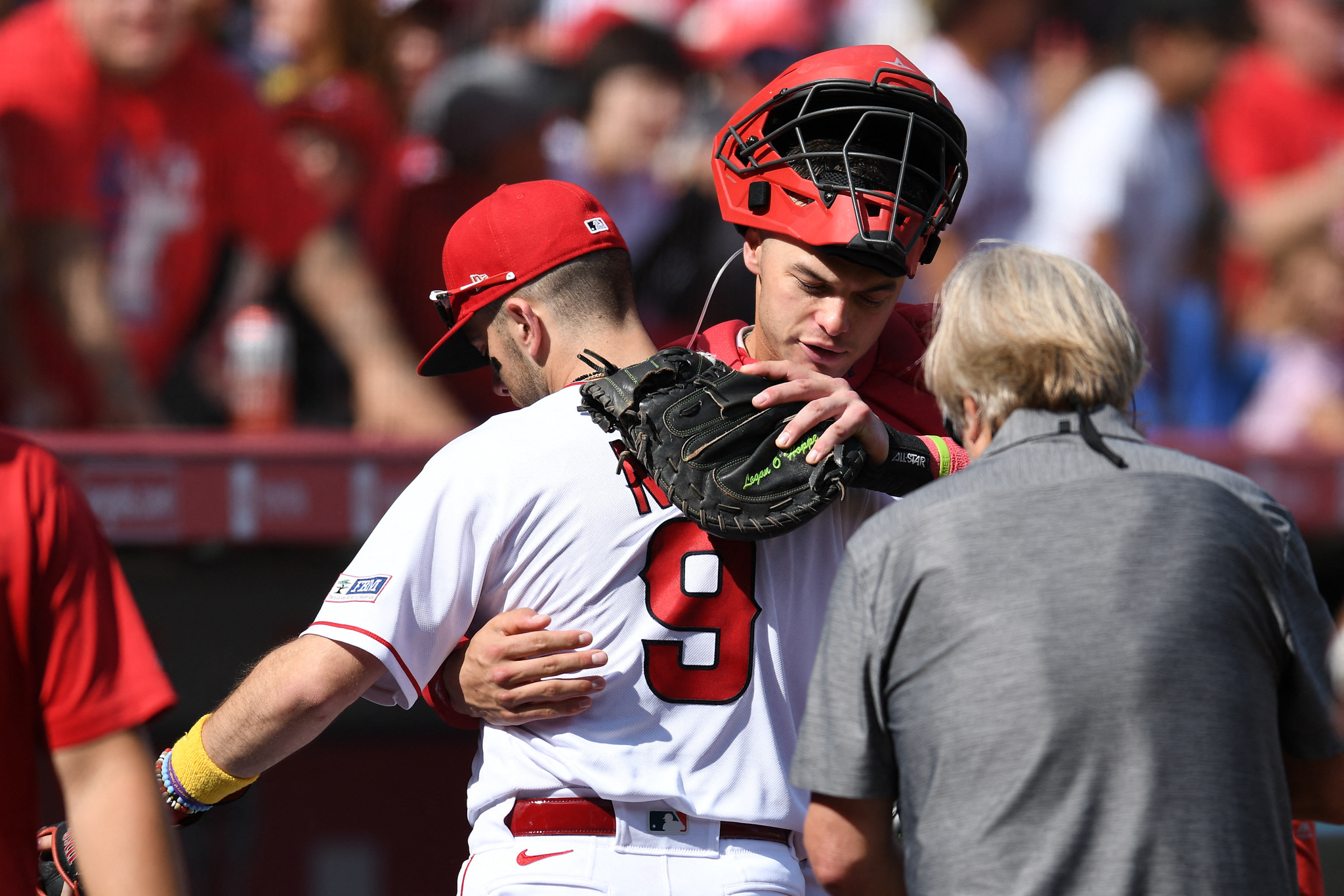 ANAHEIM, CA - APRIL 24: Los Angeles Angels first baseman Brandon Drury (23)  in the dugout wearing a Kabuto after hitting a home run in the tenth inning  during an MLB baseball