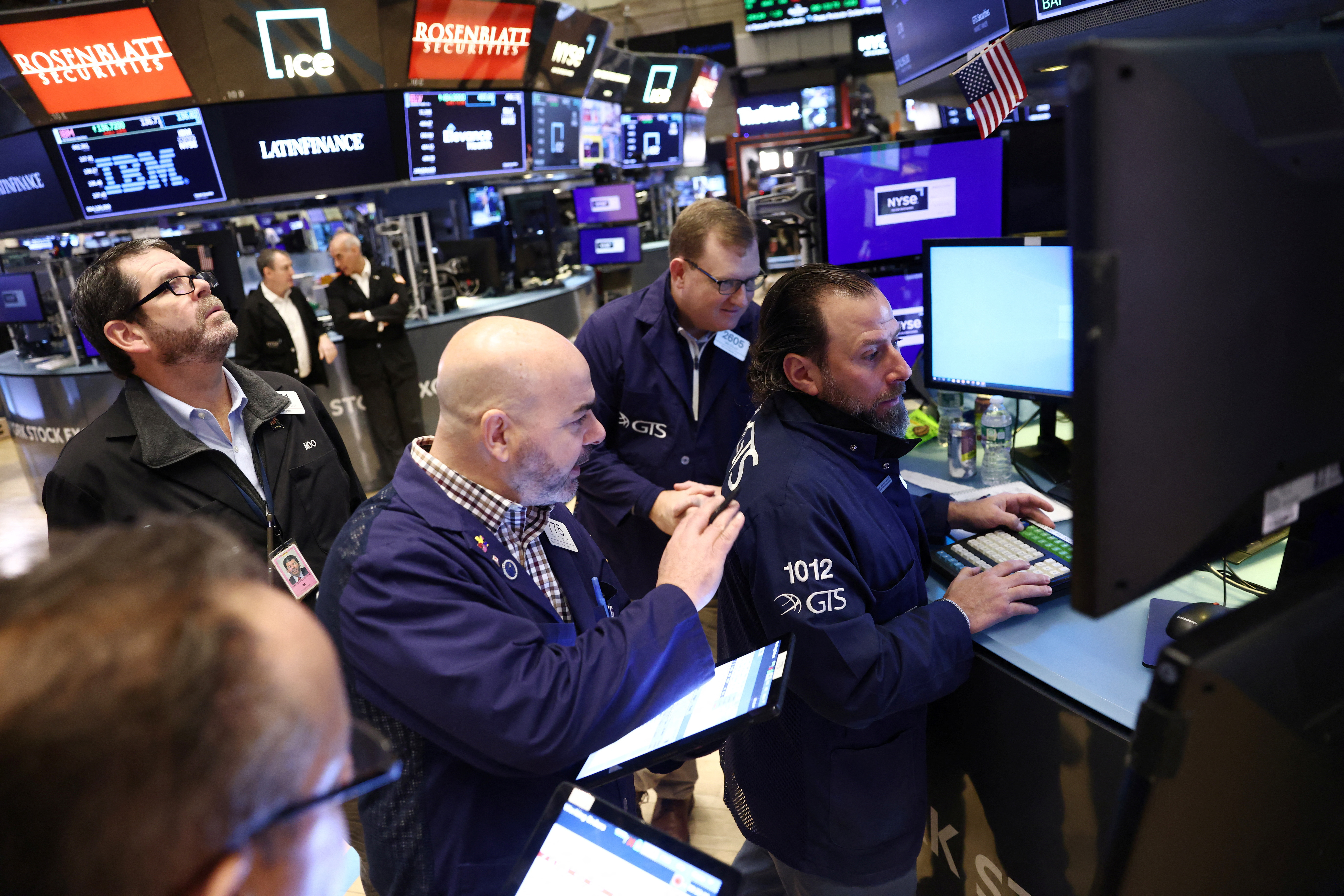Traders work on the trading floor at the New York Stock Exchange (NYSE) in New York City