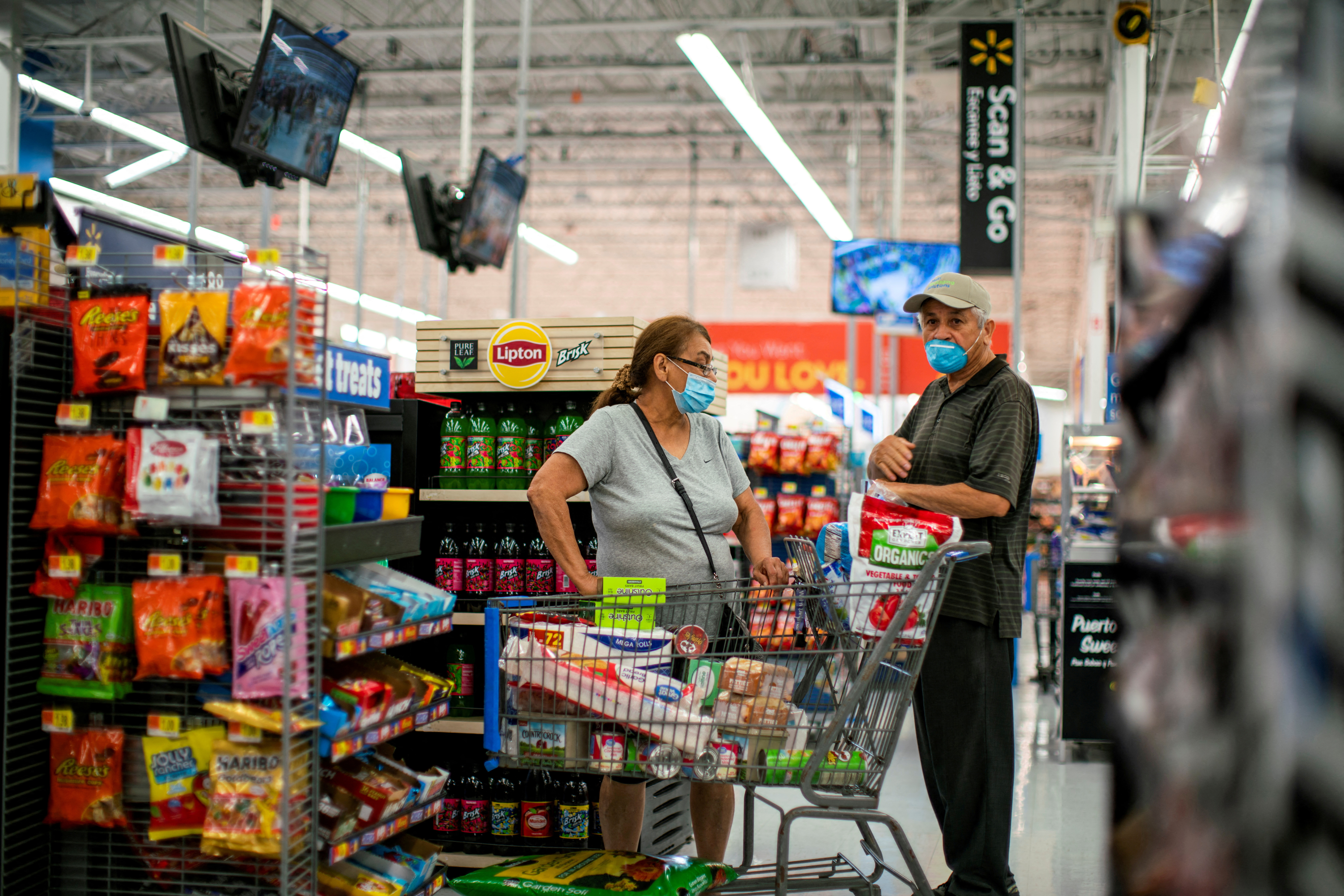 Shoppers are seen wearing masks while shopping at a Walmart store, in North Brunswick, New Jersey