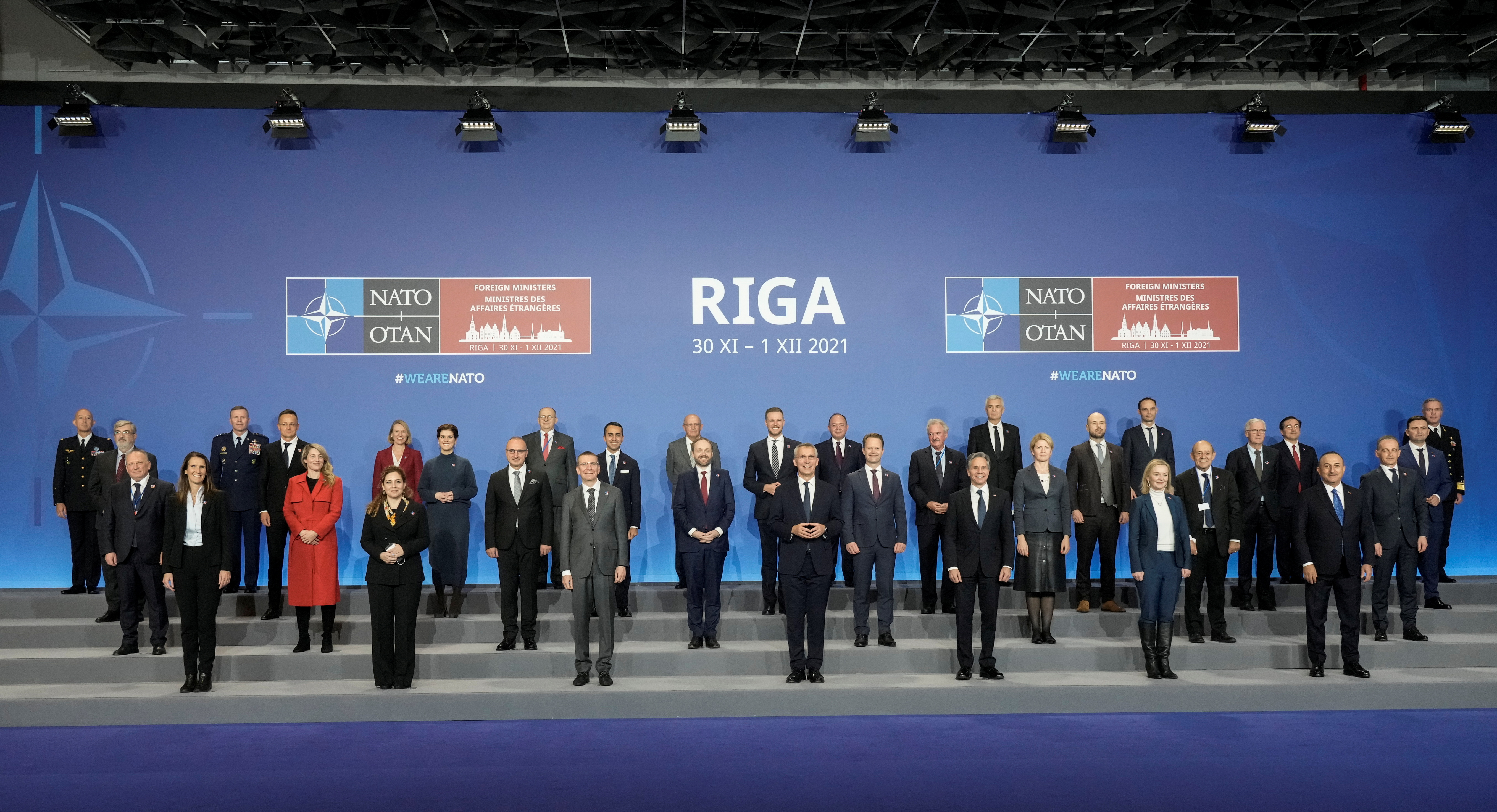 NATO Secretary General Jens Stoltenberg poses with foreign ministers for a family photo during a NATO Foreign Ministers summit in Riga, Latvia November 30, 2021. REUTERS/Ints Kalnins