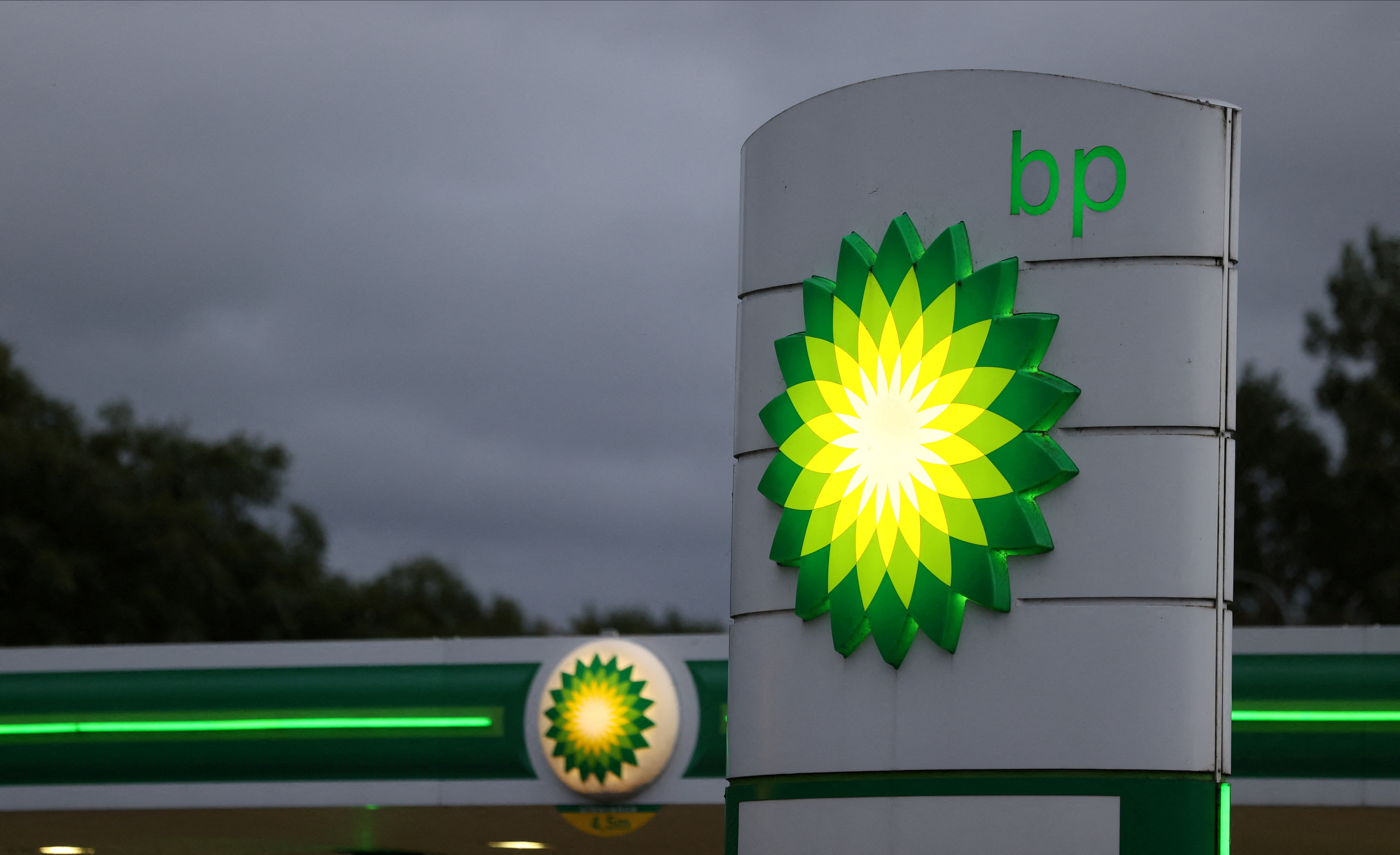 An illuminated BP sign at a petrol station in Britain