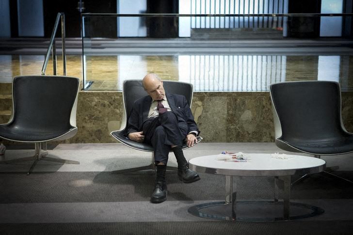 A businessman takes a mid-day nap in the lobby of a midtown hotel in the Manhattan borough of New York