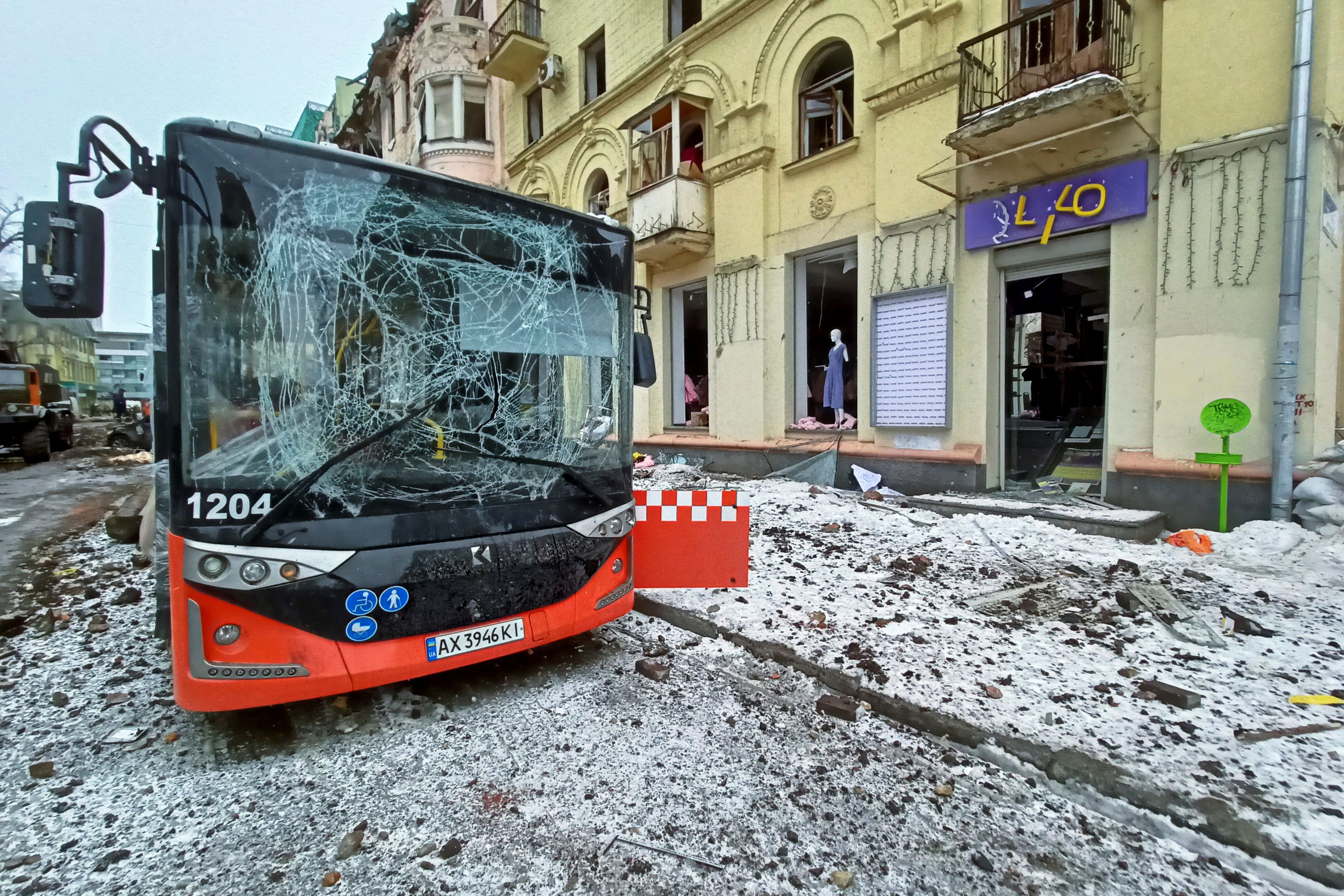 A city bus damaged by air strike is seen in central Kharkiv