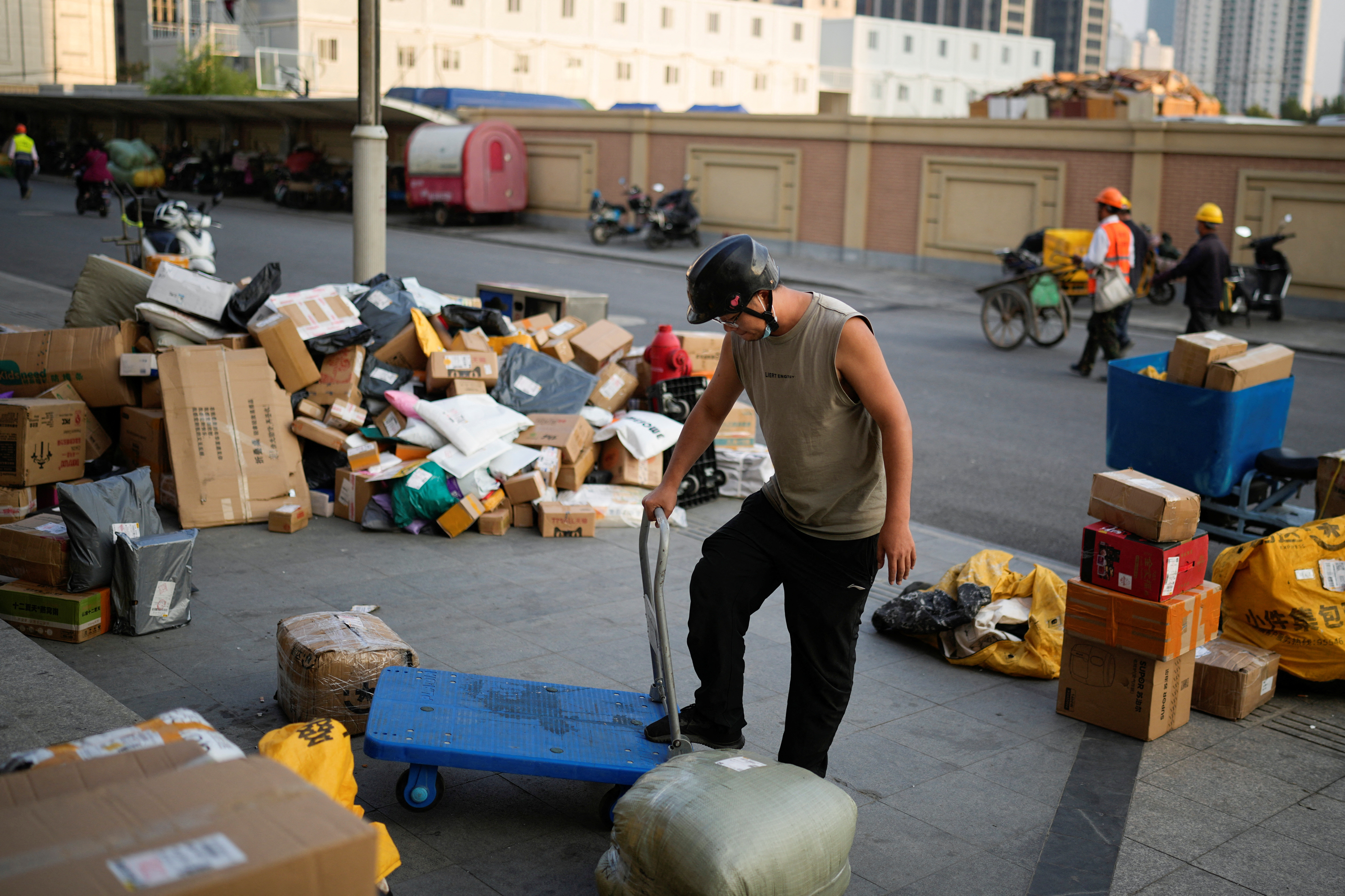 A delivery worker sorts parcels at a makeshift logistics station ahead of Alibaba's Singles' Day shopping festival, following the coronavirus disease (COVID-19) outbreak in Shanghai