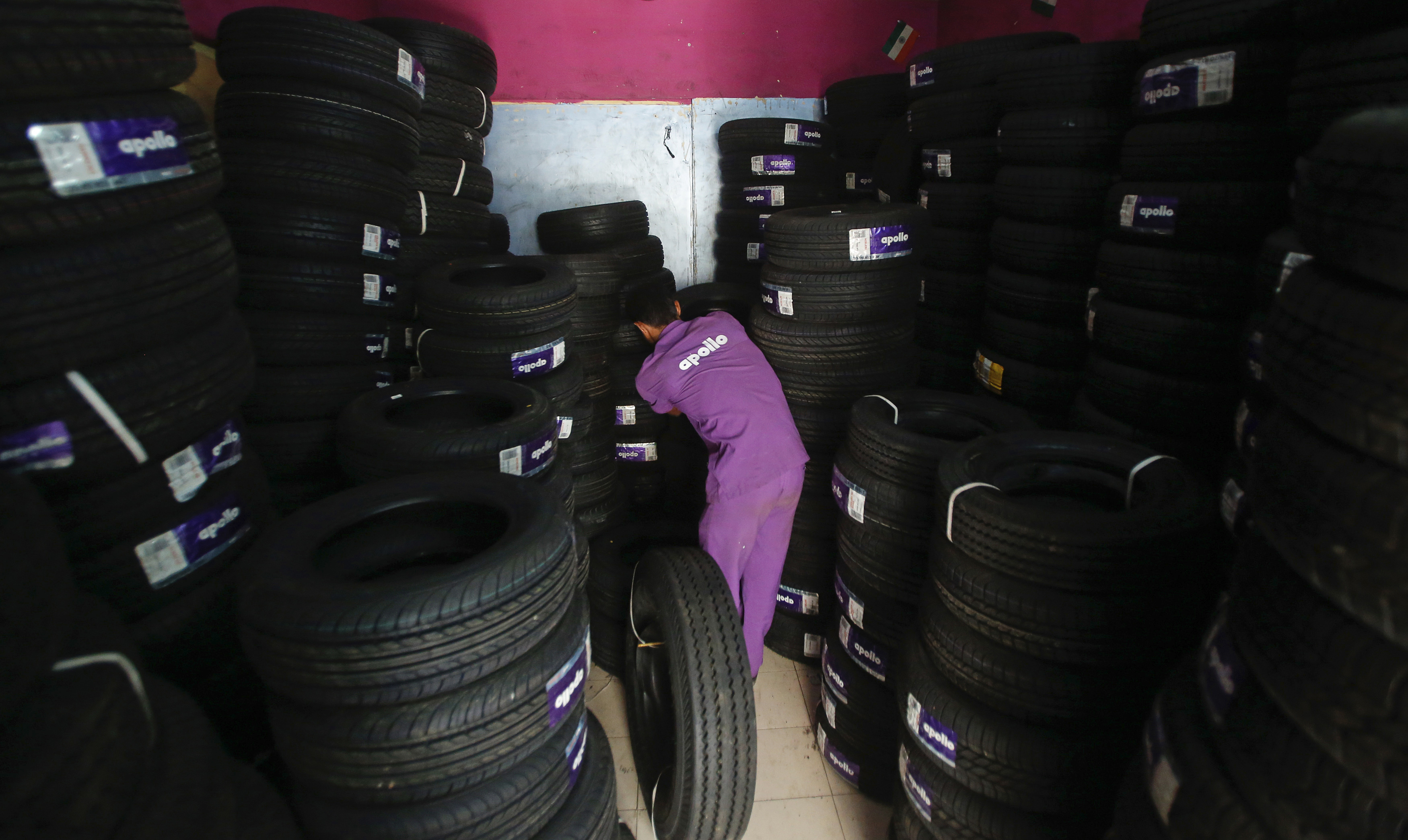 An employee works inside the warehouse at the Apollo Super Zone showroom in Mumbai