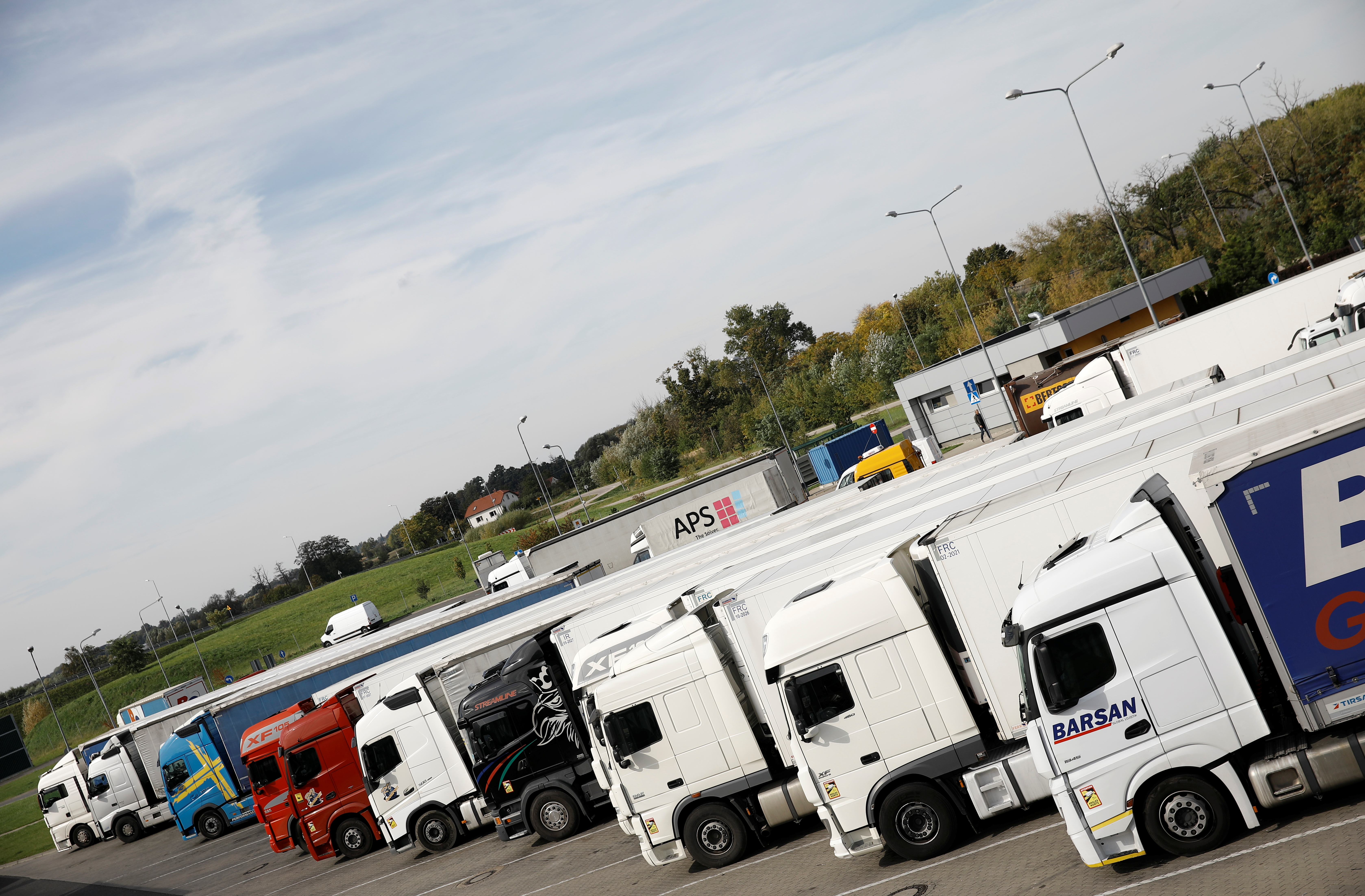 Trucks park at the highway A2 parking near Warsaw, Poland, September 28, 2021. REUTERS/Kacper Pempel