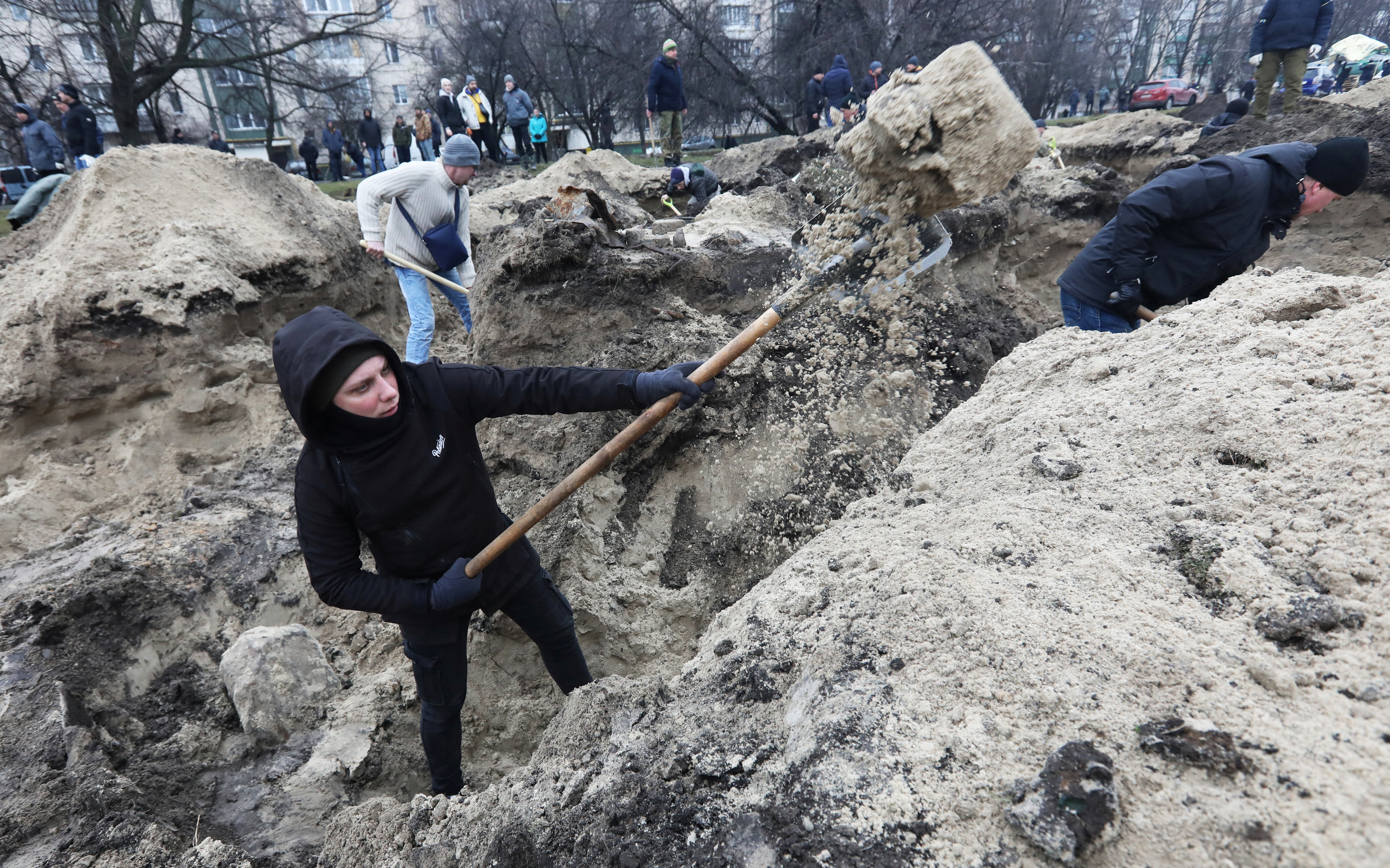 Volunteers dig trenches in Kyiv