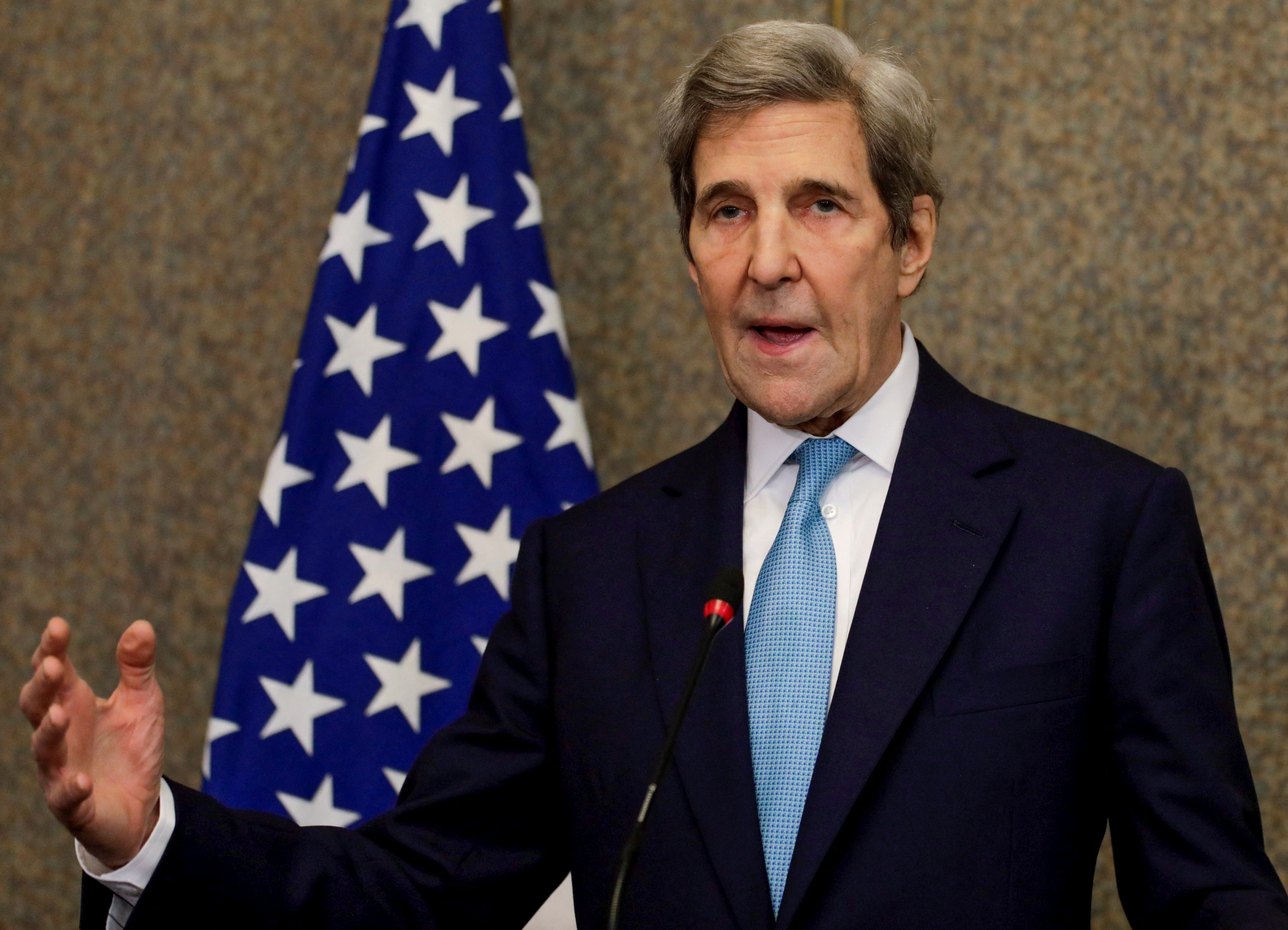 U.S. Special Presidential Envoy for Climate John Kerry gestures during a news conference with Egyptian Foreign Minister Sameh Shoukry, in Cairo