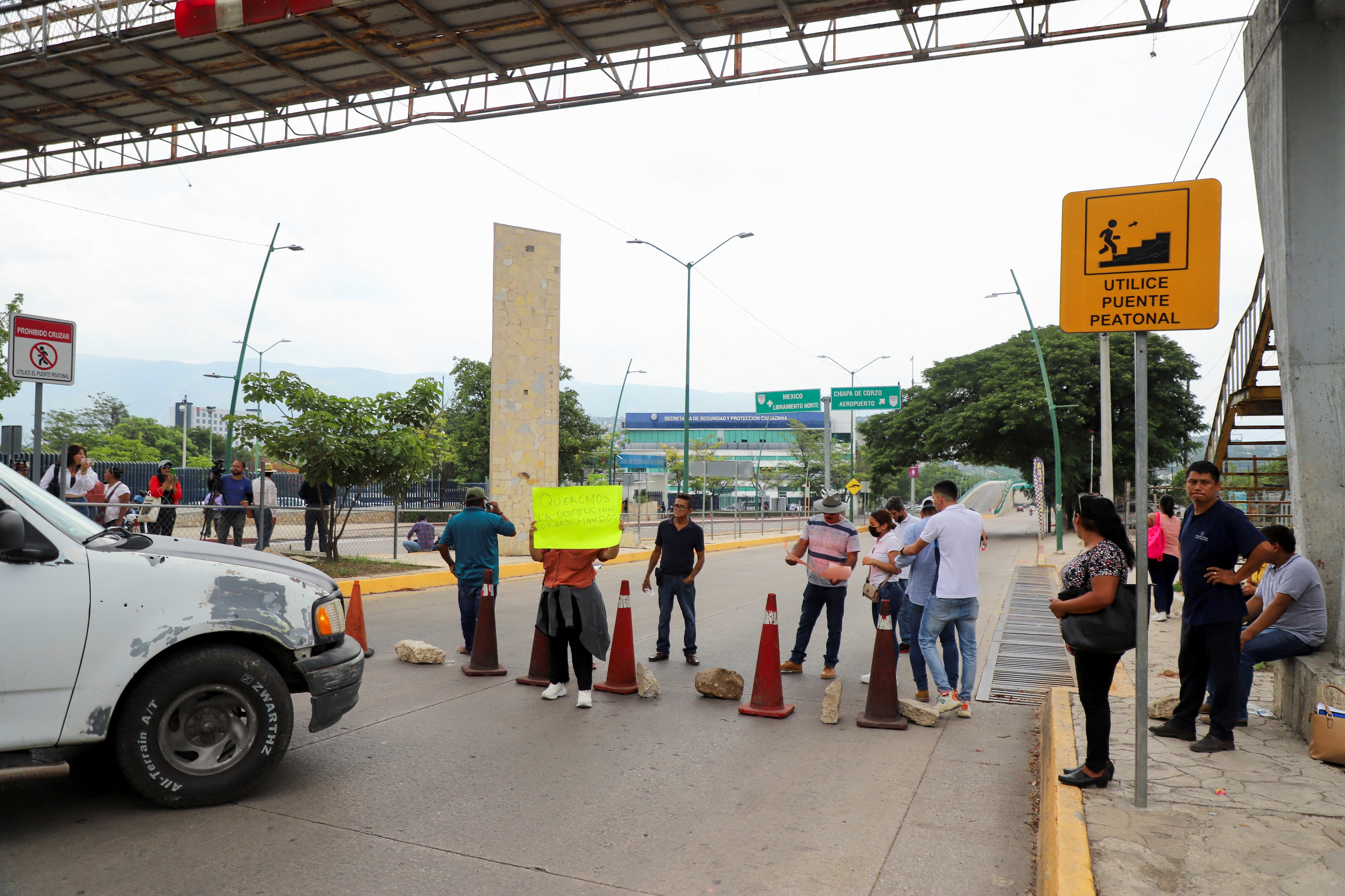 Relatives of 14 state security ministry employees who were kidnapped by members of an armed group protest in Chiapas