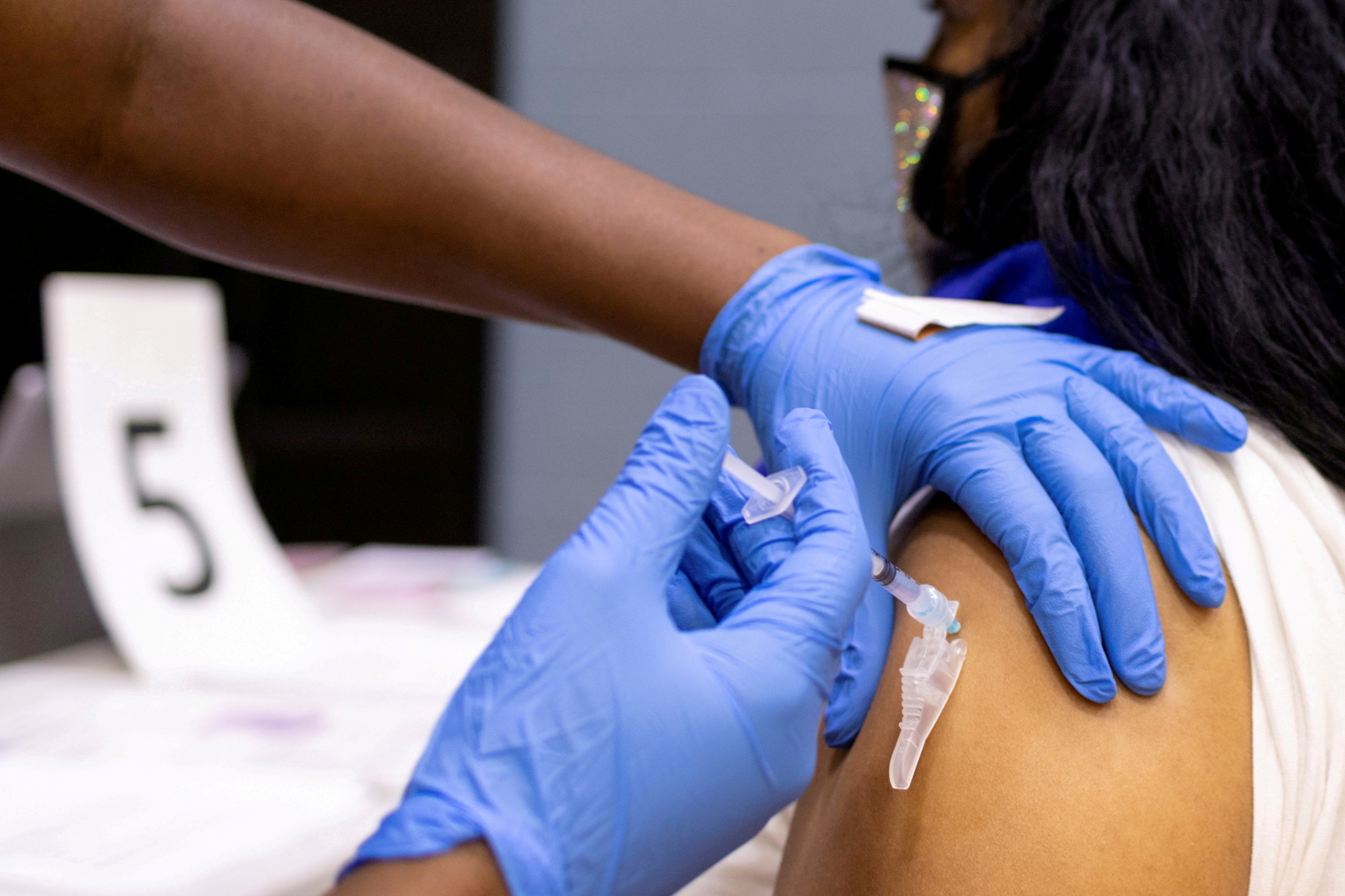 A woman receives a COVID-19 vaccine at a clinic in Philadelphia
