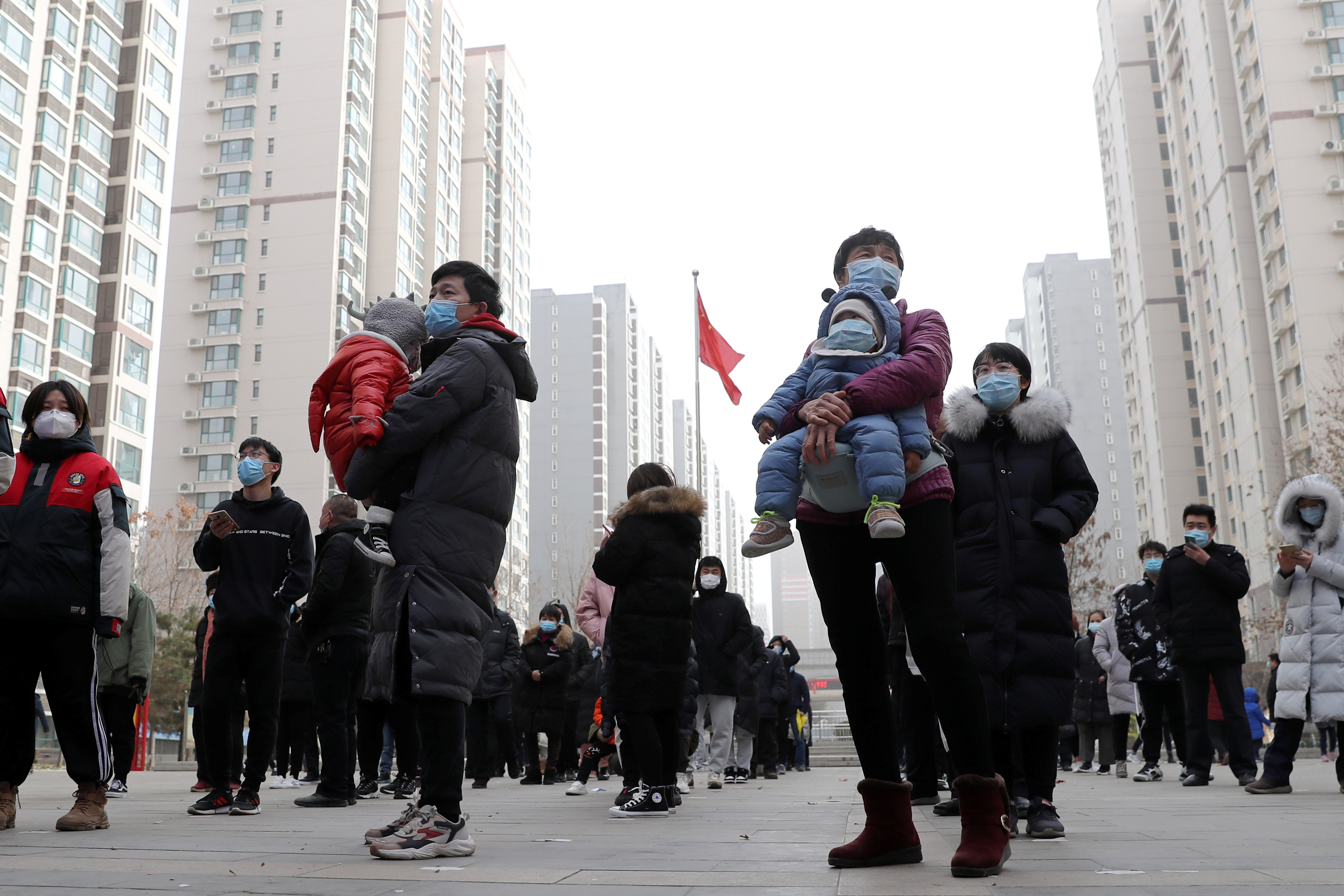 People line up for a second round of citywide nucleic acid testing at a residential compound in Shijiazhuang