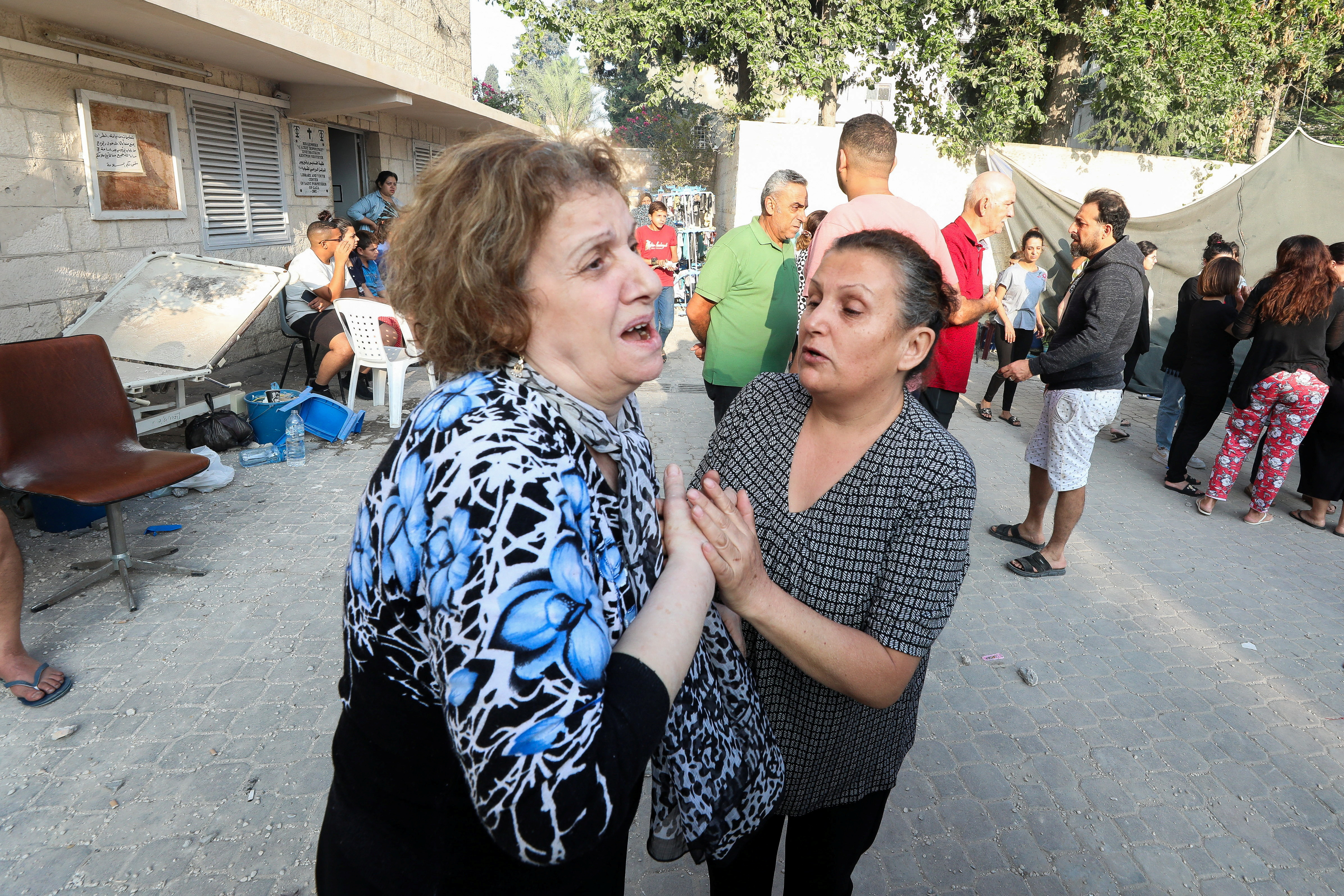 Women react at Greek Orthodox Saint Porphyrius Church damaged by an Israeli strike, in Gaza City