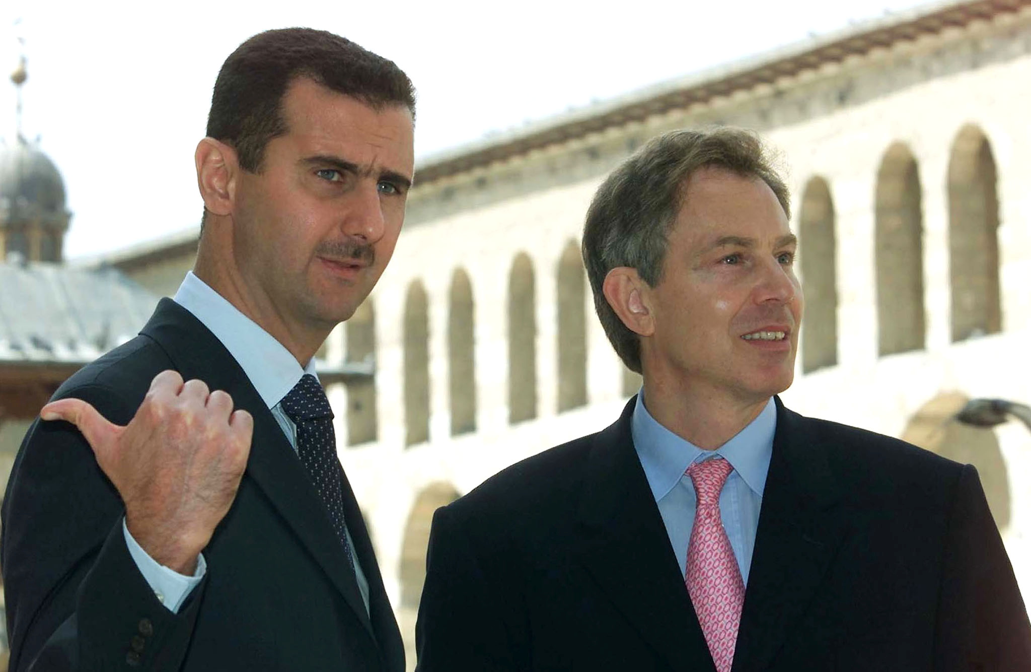 Britain's Prime Minister Tony Blair (R) and Syrian President Bashar al-Assad visit the Omayyad Mosque in Damascus