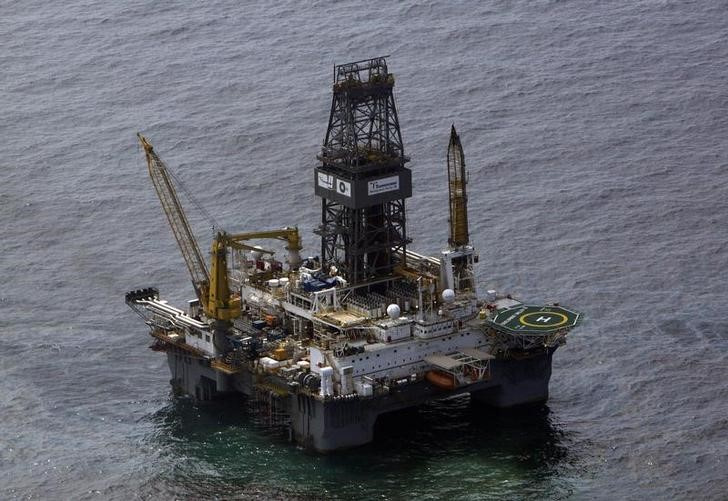 The Transocean Development Driller III, which is drilling the relief well, is seen surrounded by part of the oil slick covering the site of the BP oil spill in the Gulf of Mexico