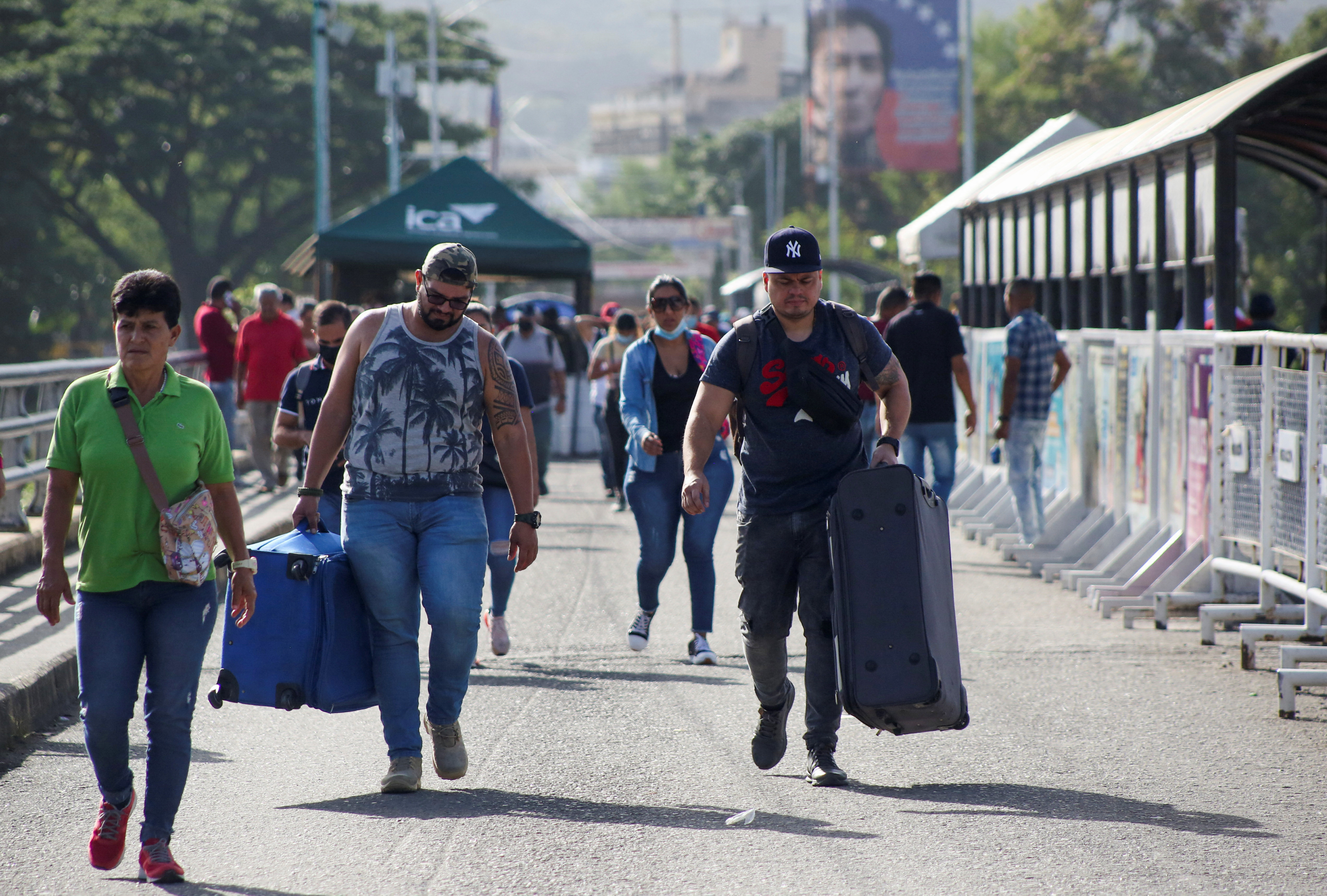 People cross the Colombian-Venezuelan border over the Simon Bolivar international bridge in Cucuta