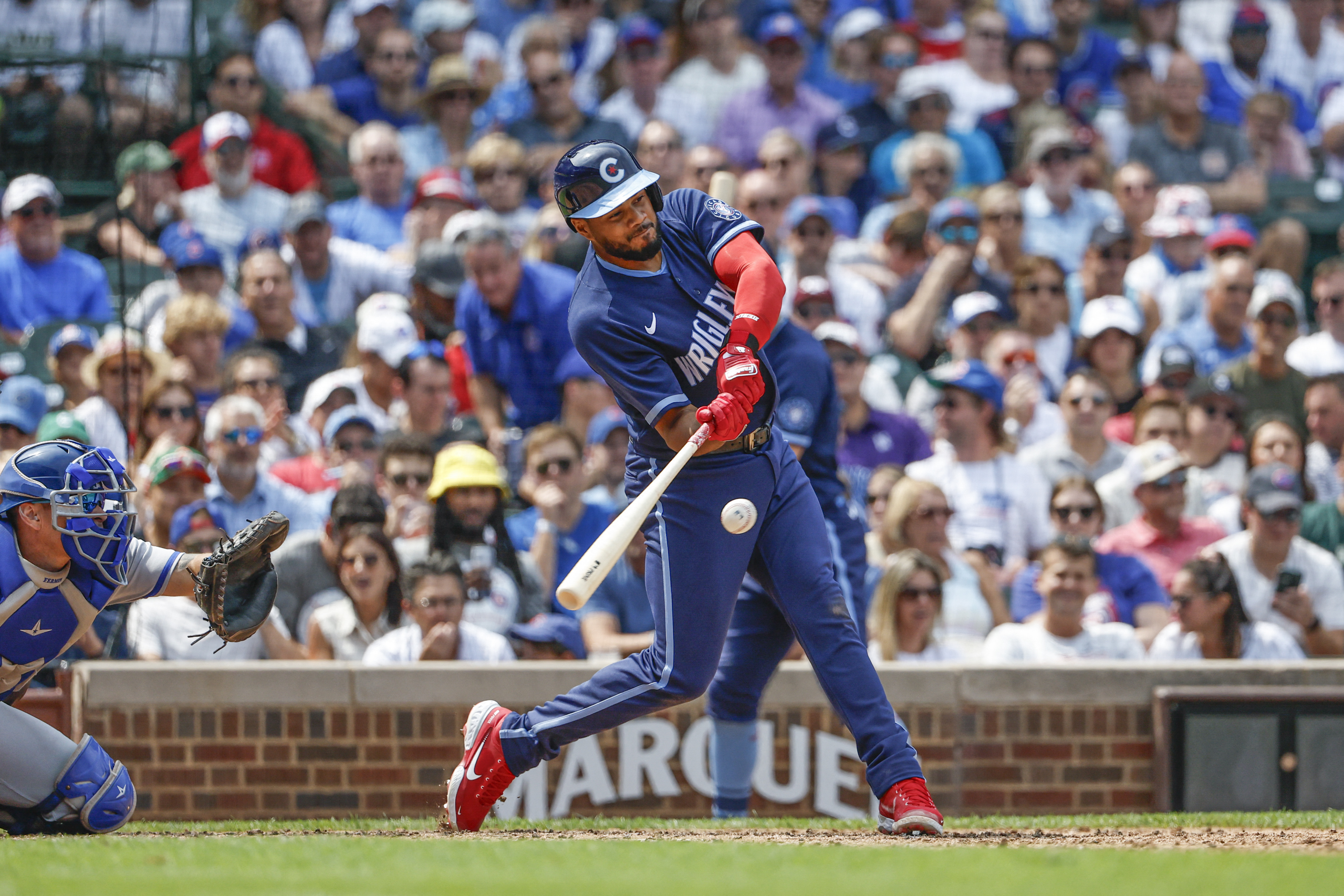 Cubs 1B coach Mike Napoli cup checks C Yan Gomes