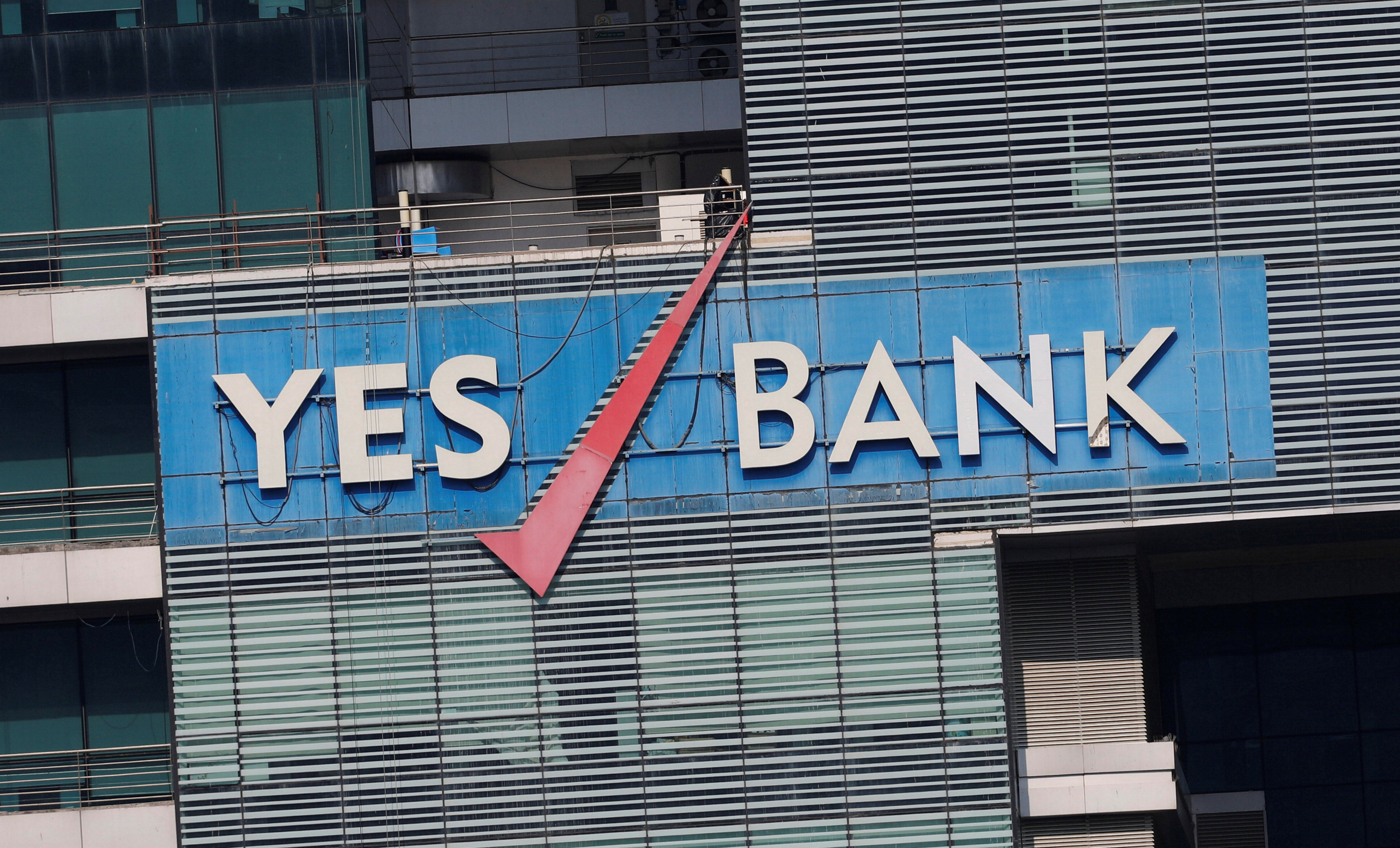 The logo of Yes Bank is pictured on the facade of its headquarters in Mumbai