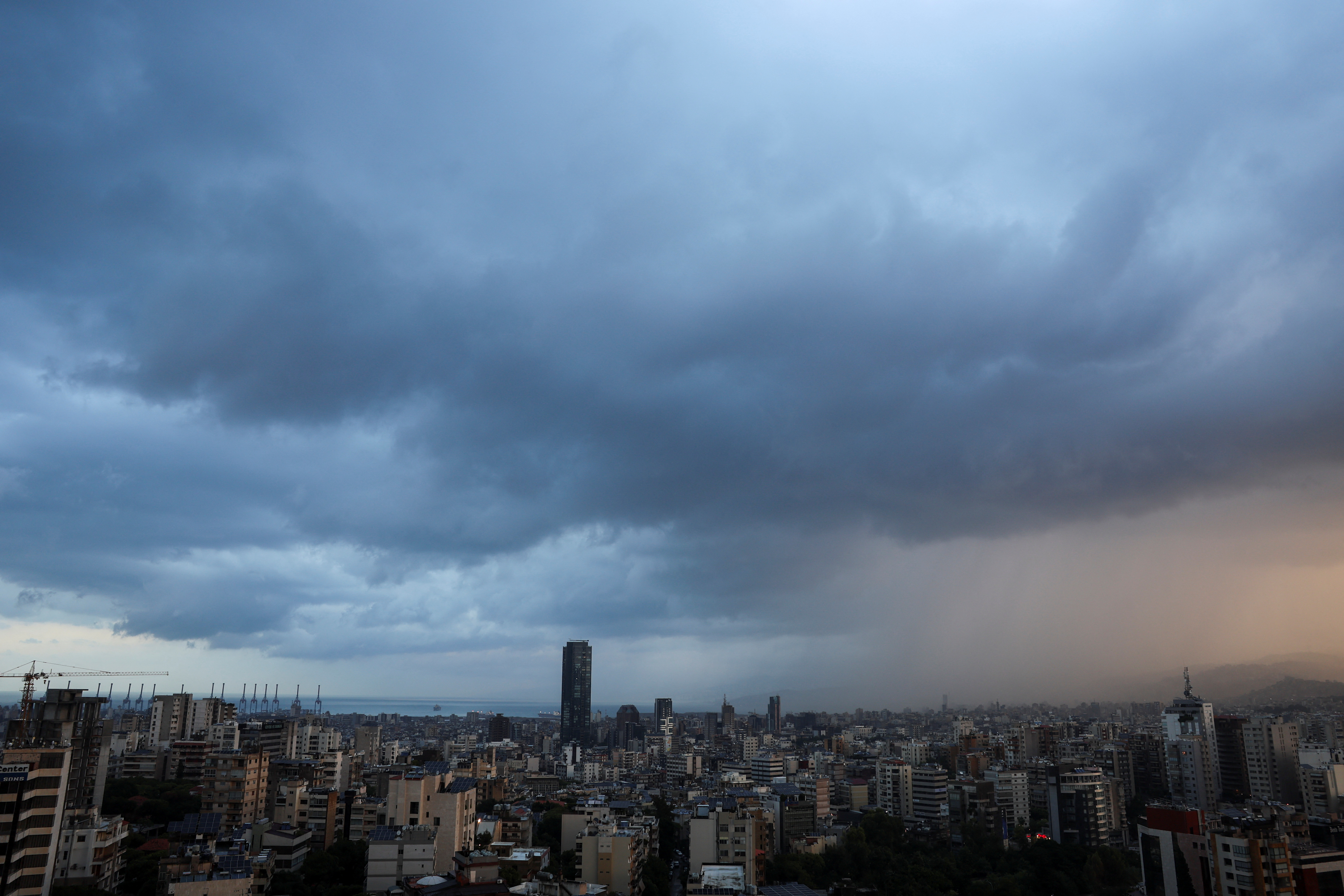 Dark clouds blanket the sky over Beirut suburbs during heavy rain