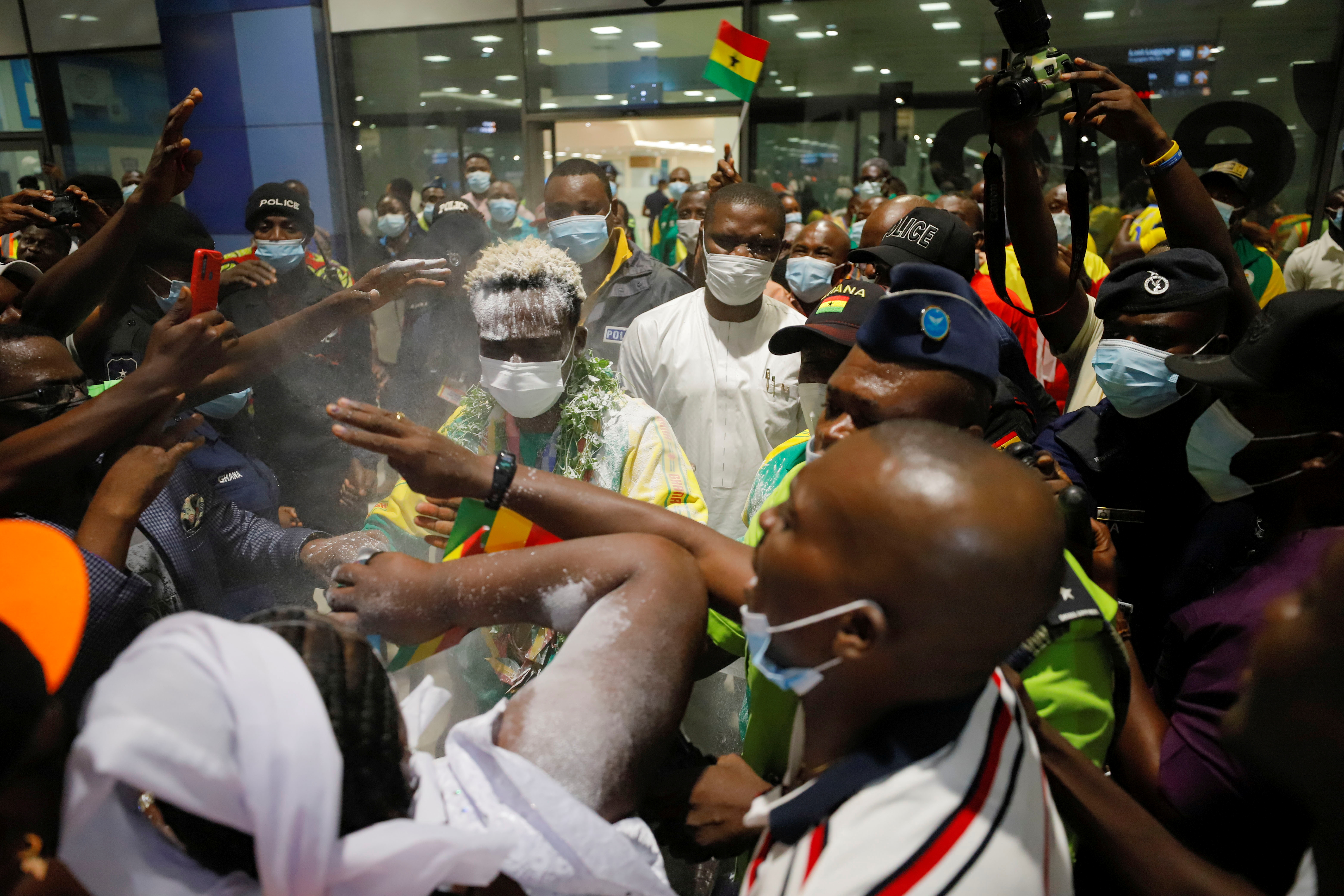 Supporters welcome Ghana's boxer, Takyi as he arrives at the Kotoka International Airport in Accra