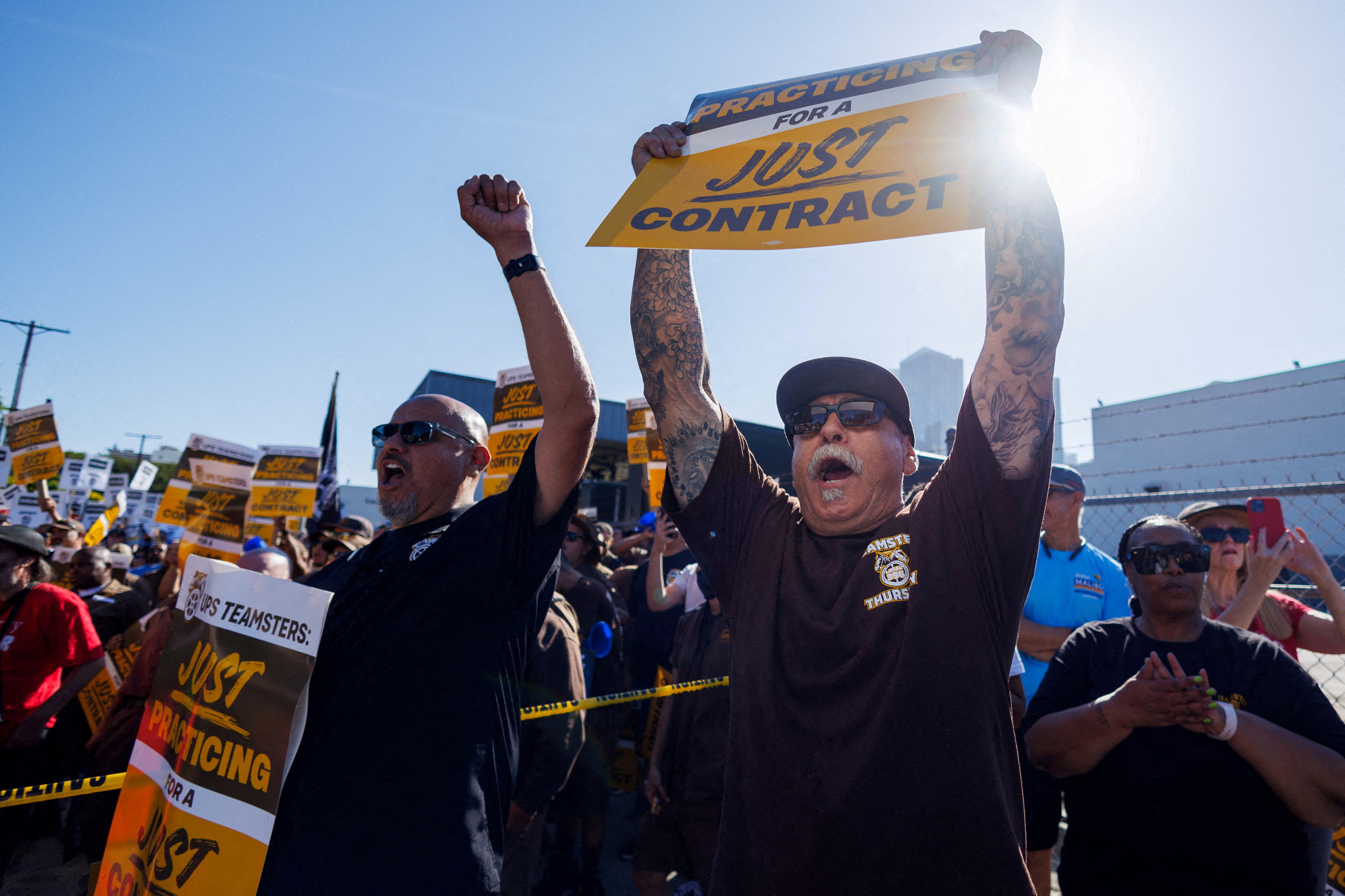 Teamsters employed by UPS hold a rally outside a UPS facility in Los Angeles