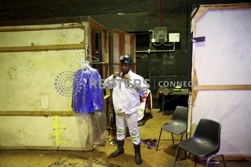 Nkululeko Khutshwa, a stage actor, one of a 40-member cast and 13-piece band, prepares backstage at the State Theater in Pretoria