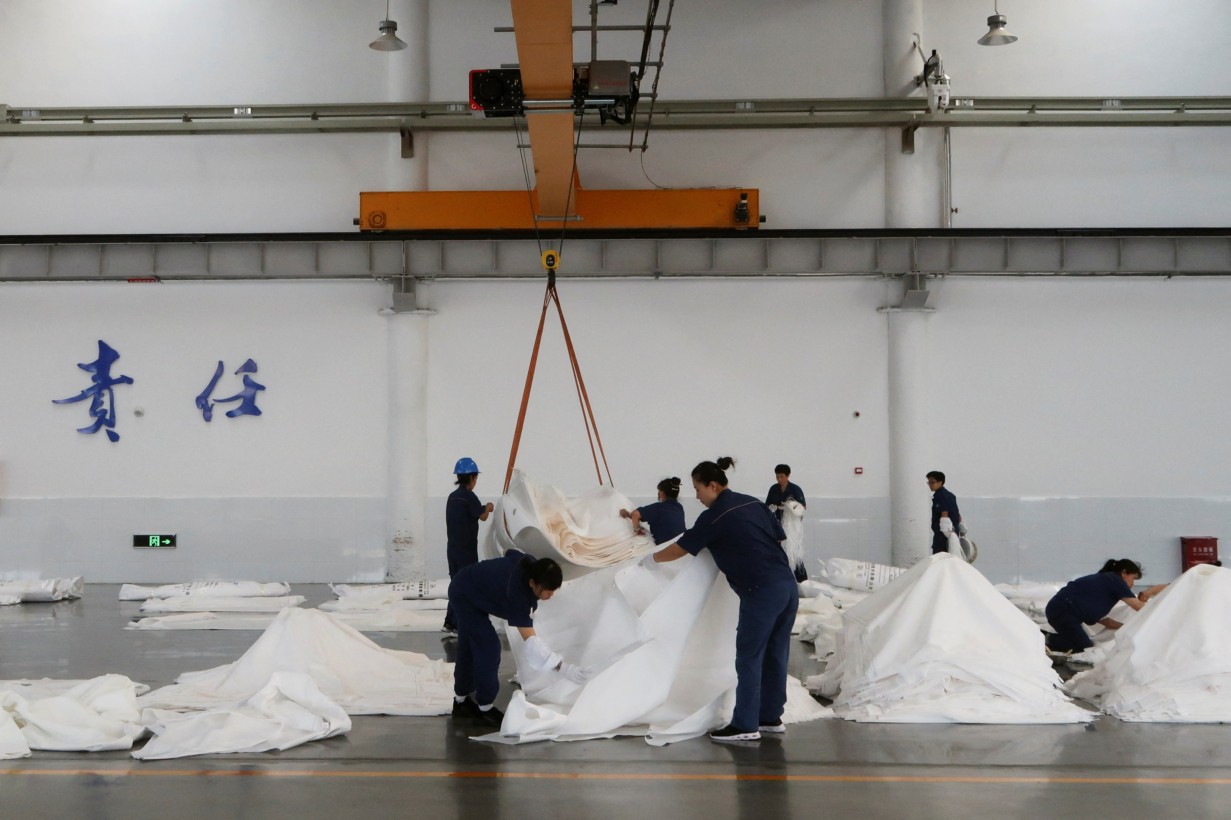 Employees work at Jingjin filter press factory in Dezhou