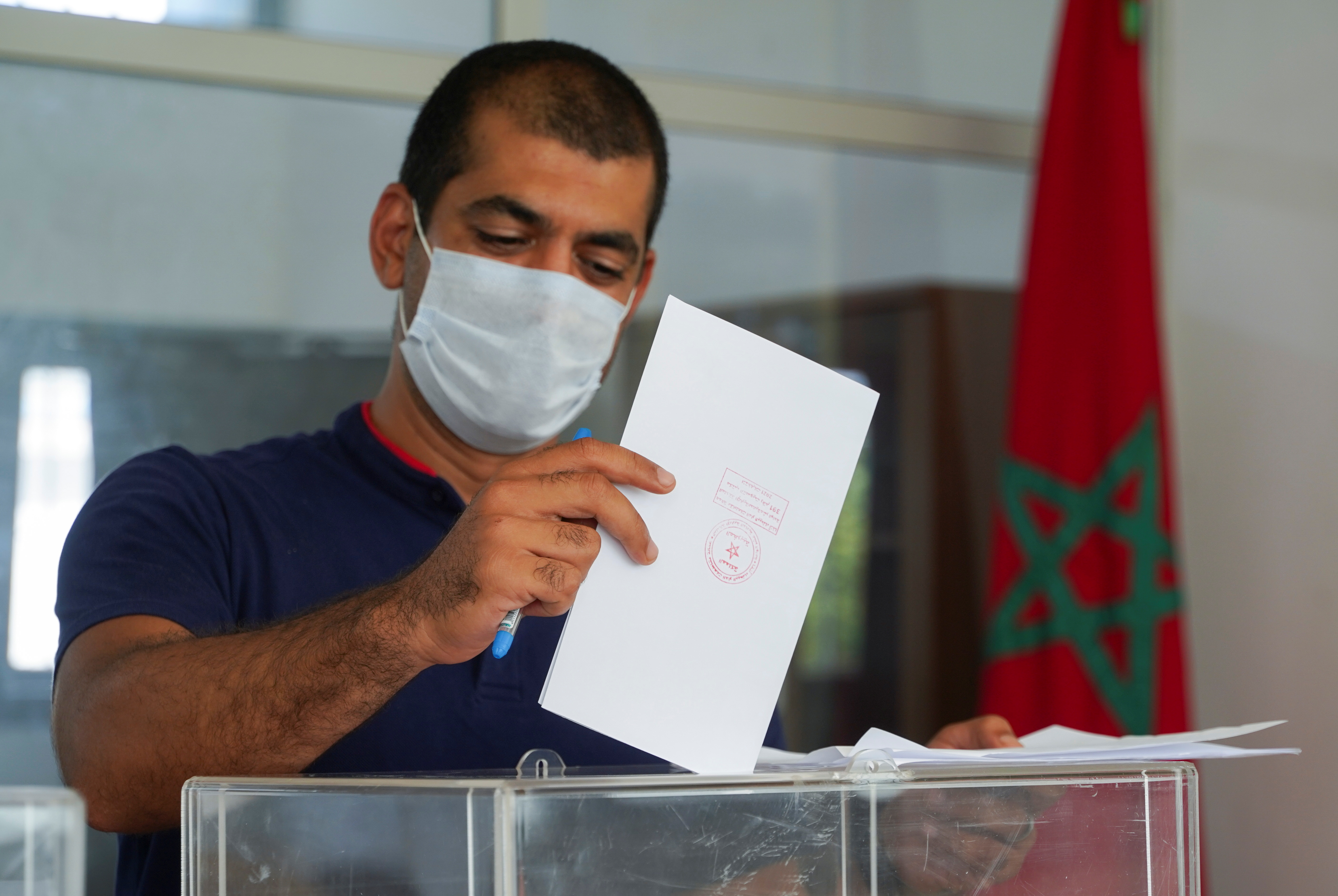 A man casts his vote at a polling station during parliamentary and local elections, in Casablanca