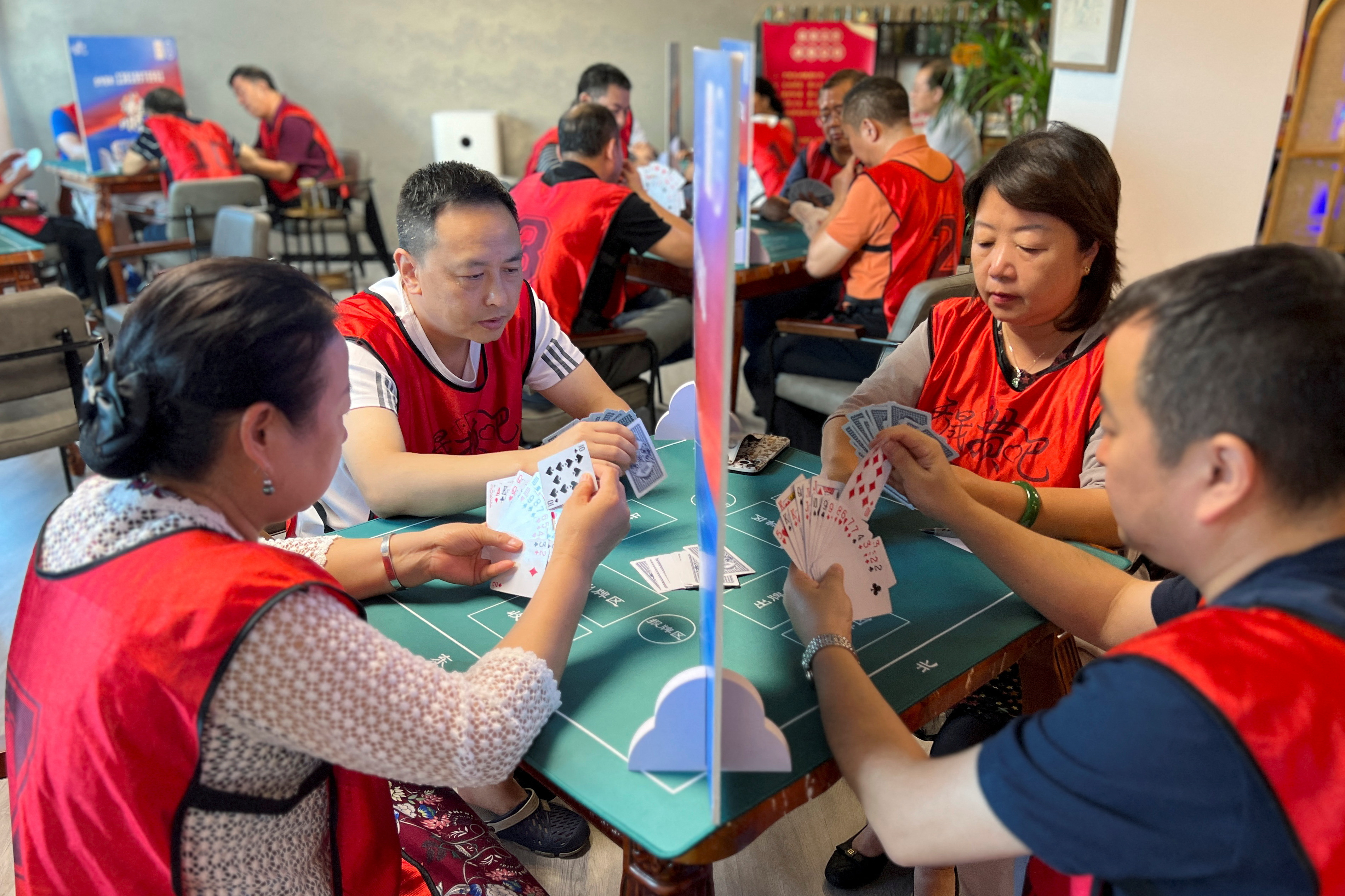 Competition of guandan, a poker-like card game, in Beijing
