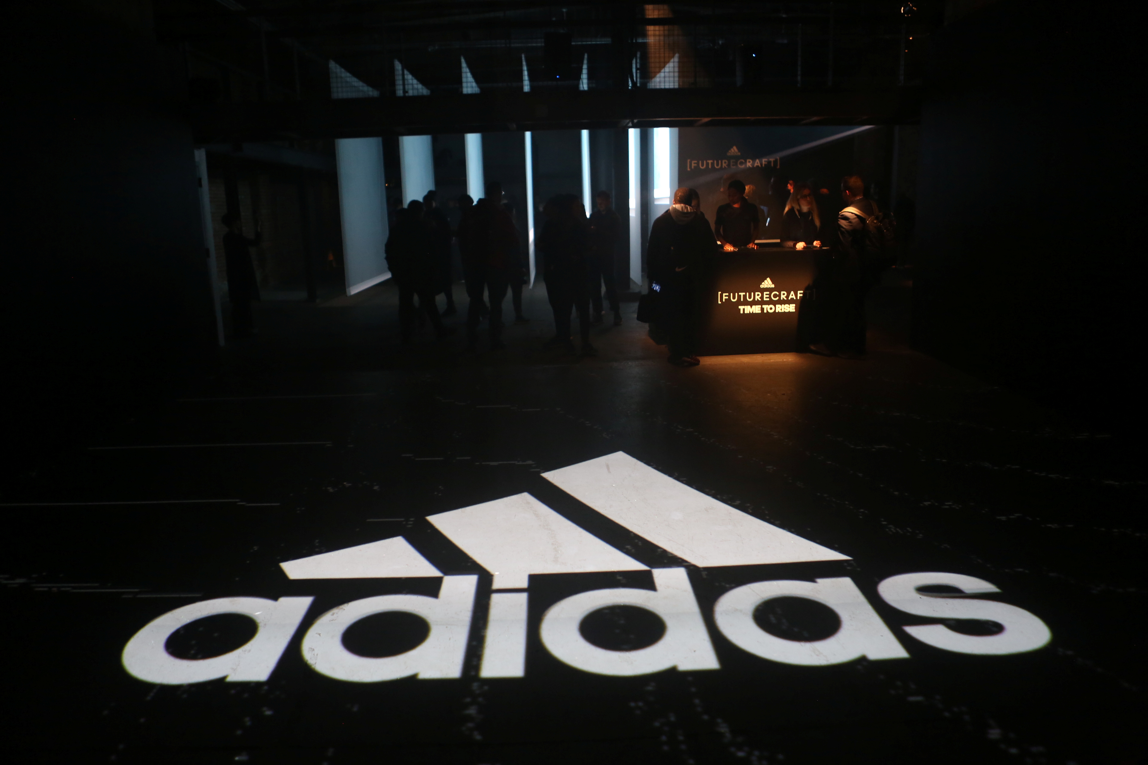 An Adidas logo is seen at the new Futurecraft shoe unveiling event in New York City