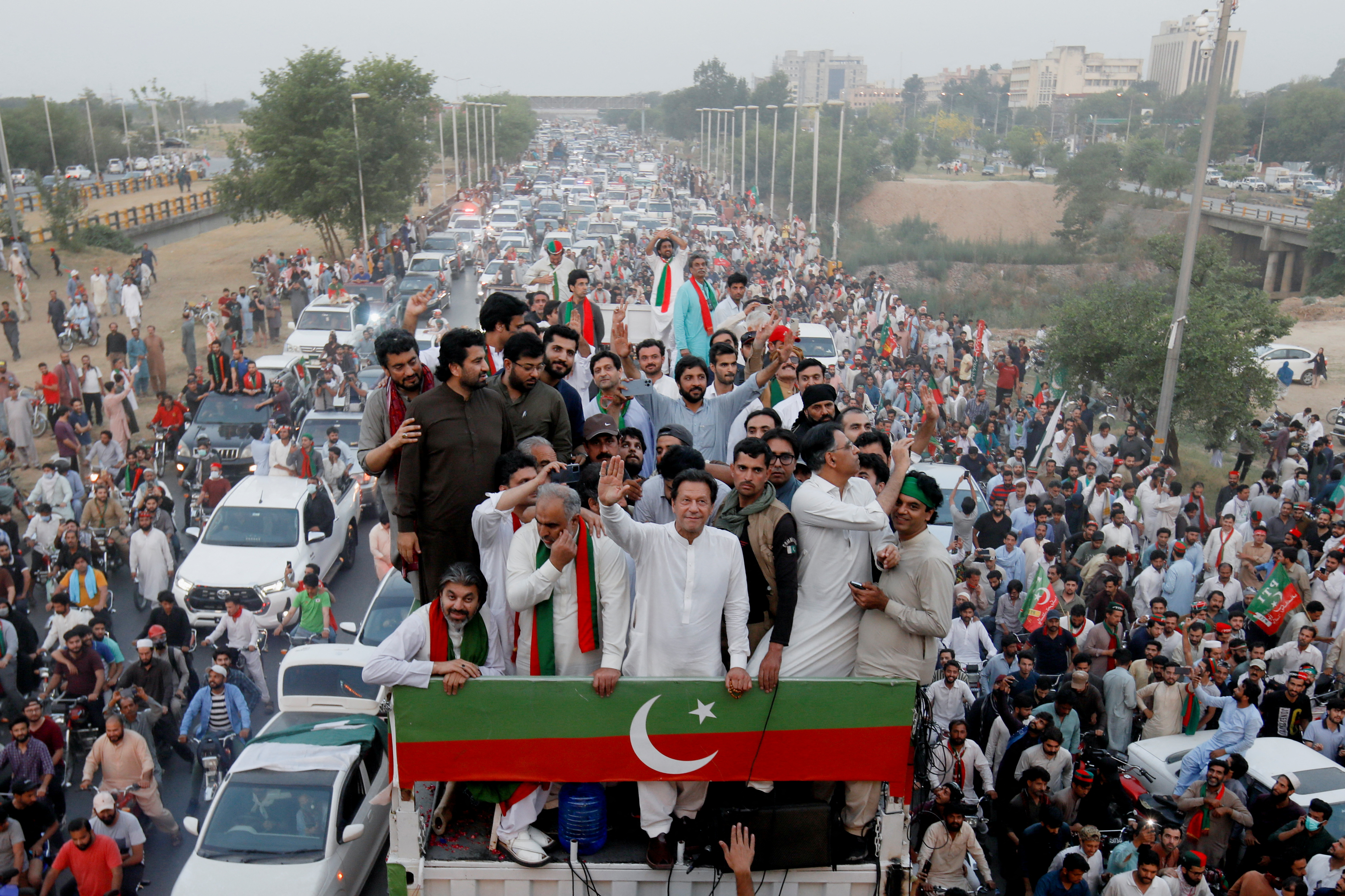 Ousted Pakistani Prime Minister Imran Khan gestures as he leads a protest march in Islamabad