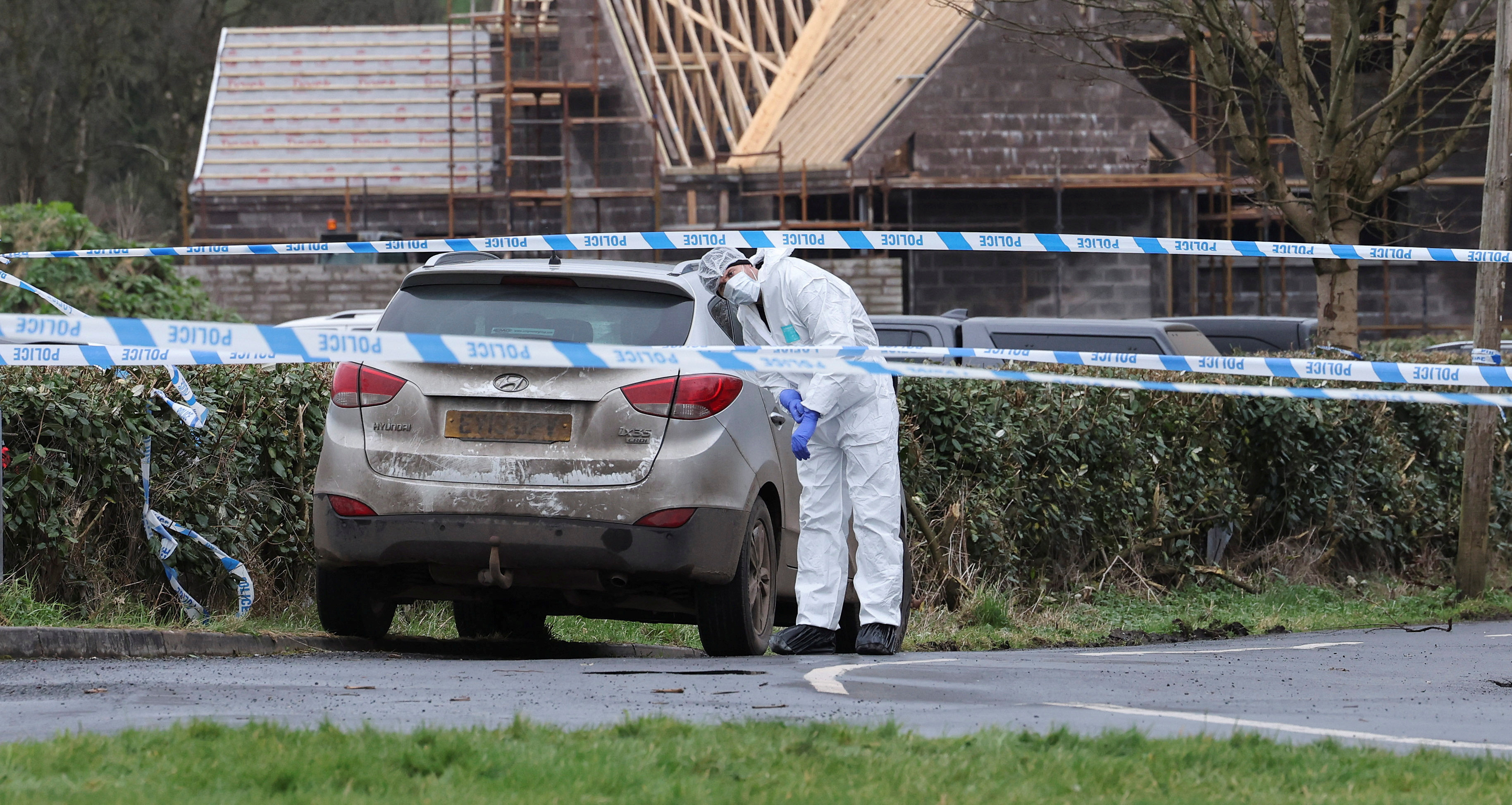 Forensic officer from PSNI works at the Youth Sport Omagh sports complex where off-duty PSNI Detective Chief Inspector John Caldwell was shot