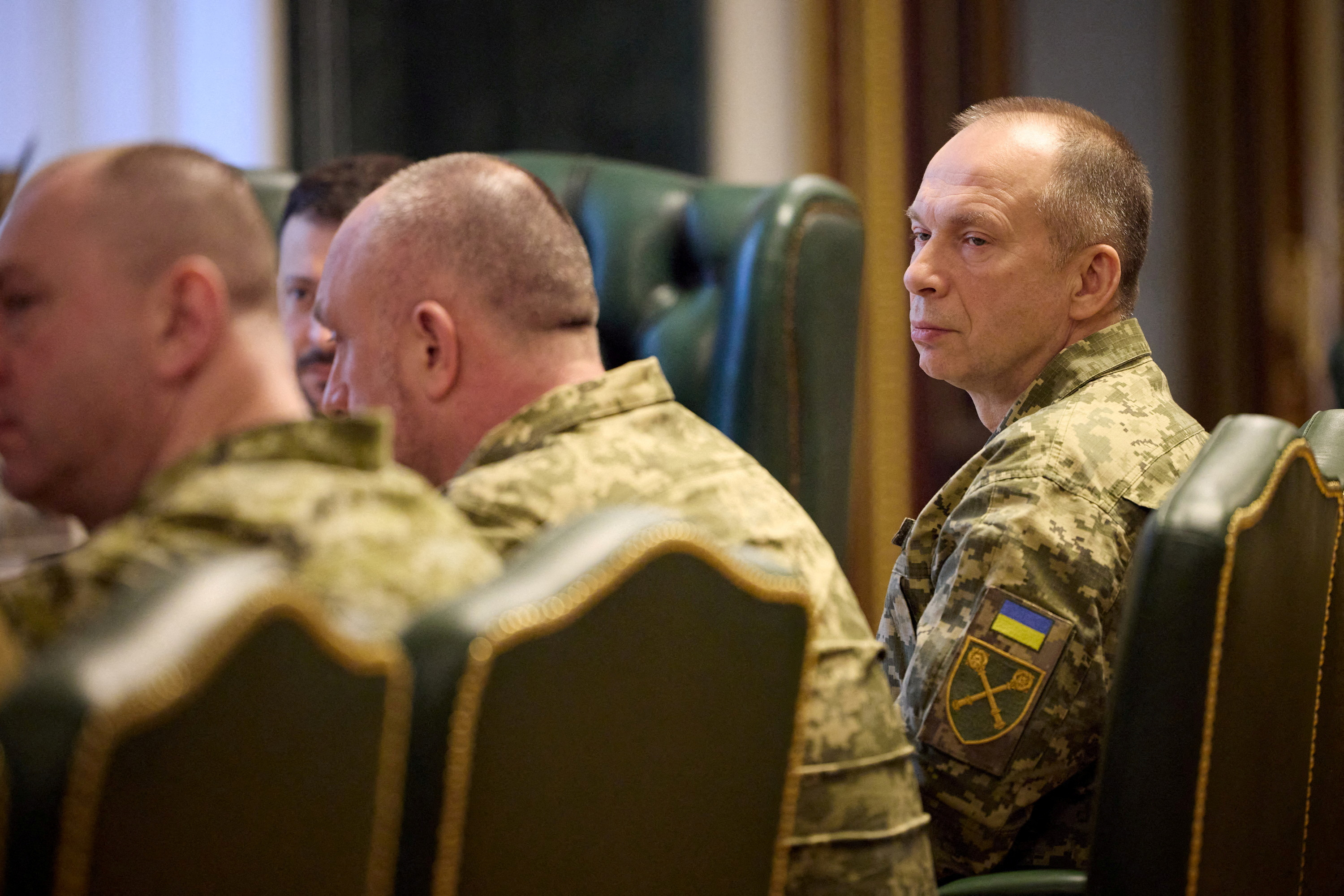 Ukraine's President Zelenskiy attends a meeting with newly appointed top military commanders in Kyiv