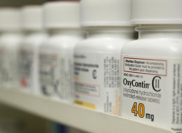 Bottles of prescription painkiller OxyContin, 40mg pills, made by Purdue Pharma L.D. sit on a shelf at a local pharmacy in Provo