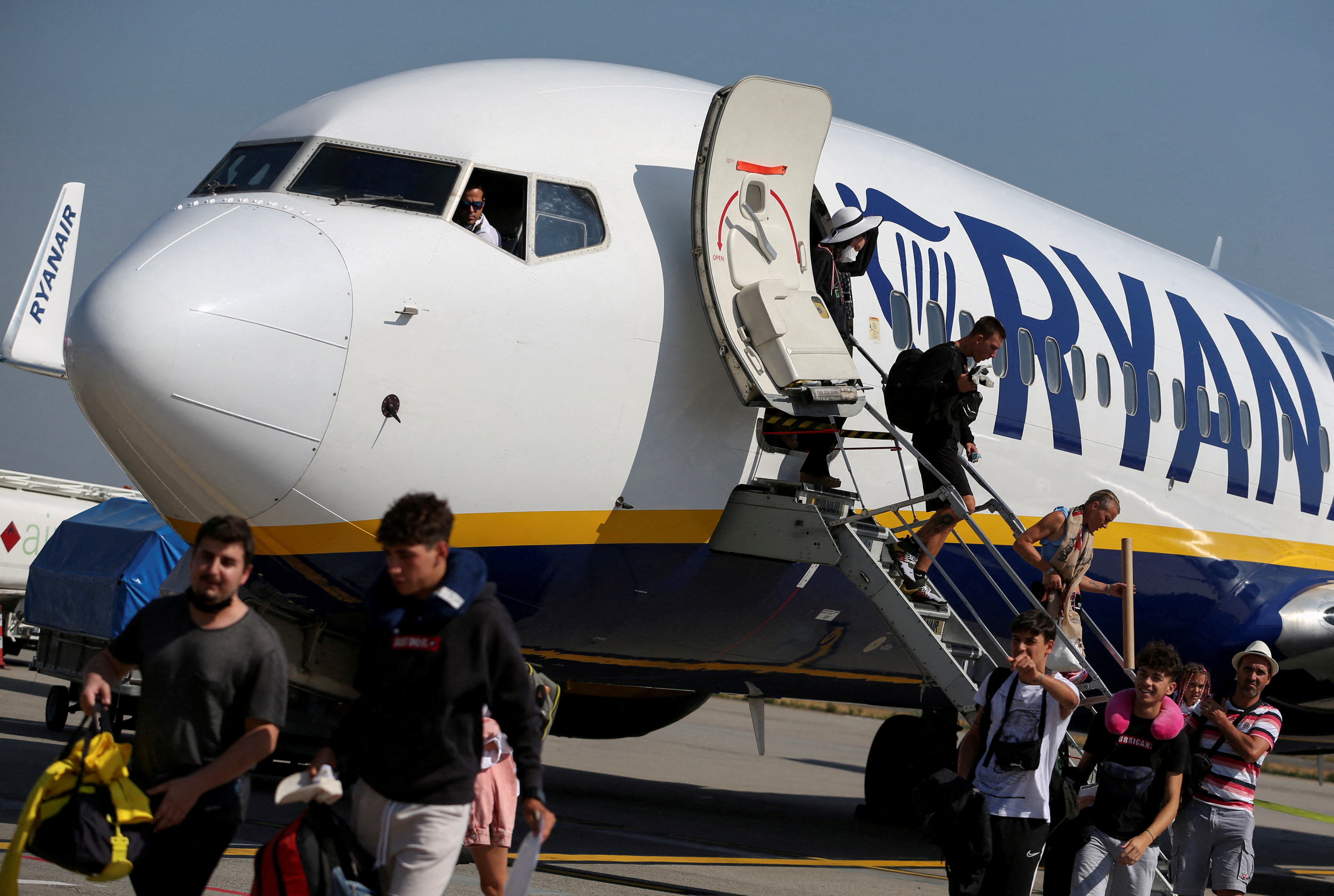 Passengers alight from a Ryanair aircraft at Ferenc Liszt International Airport in Budapest