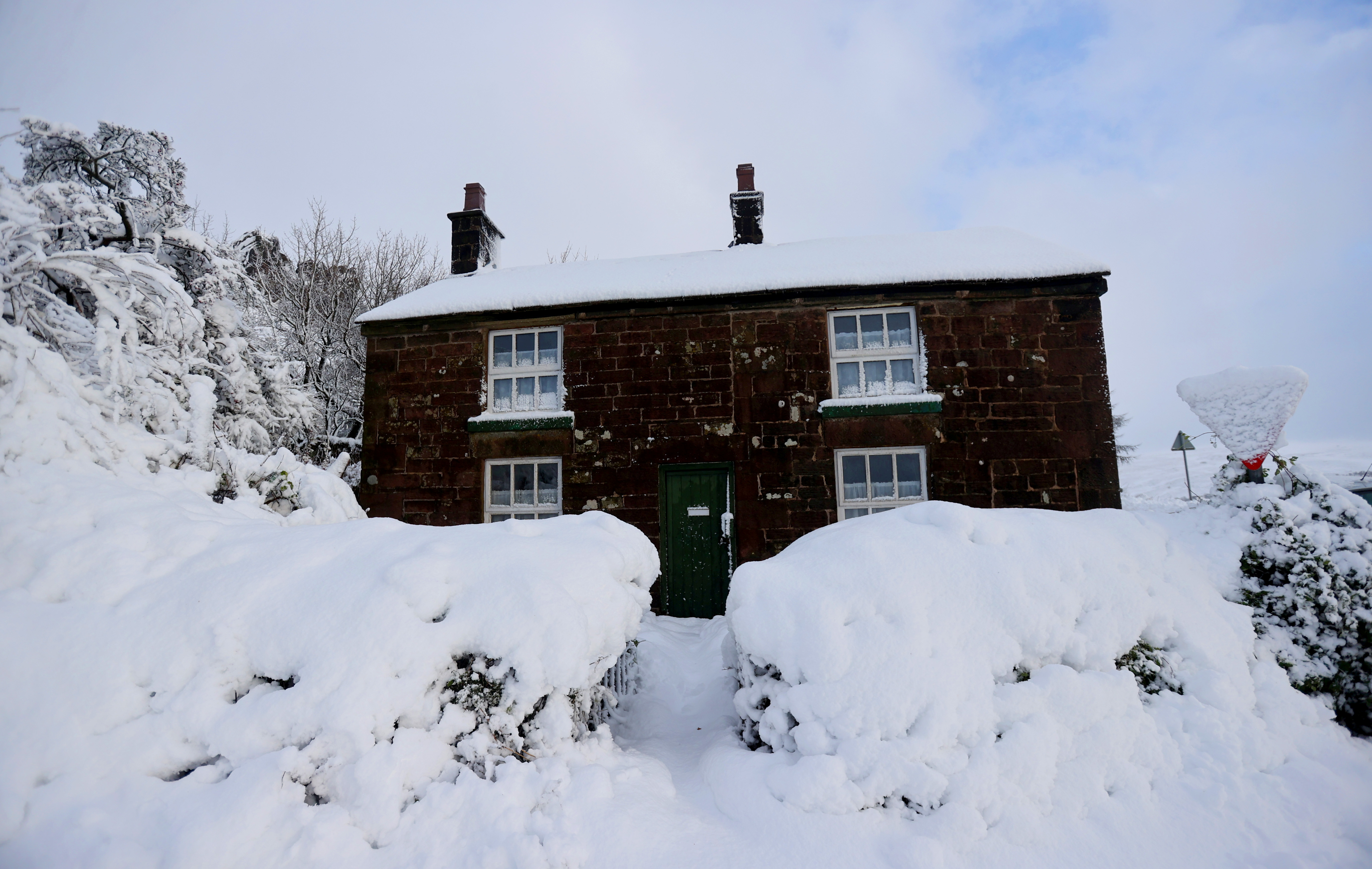 A general view of a house that’s covered in snow that fell overnight from Storm Arwen, in Leek