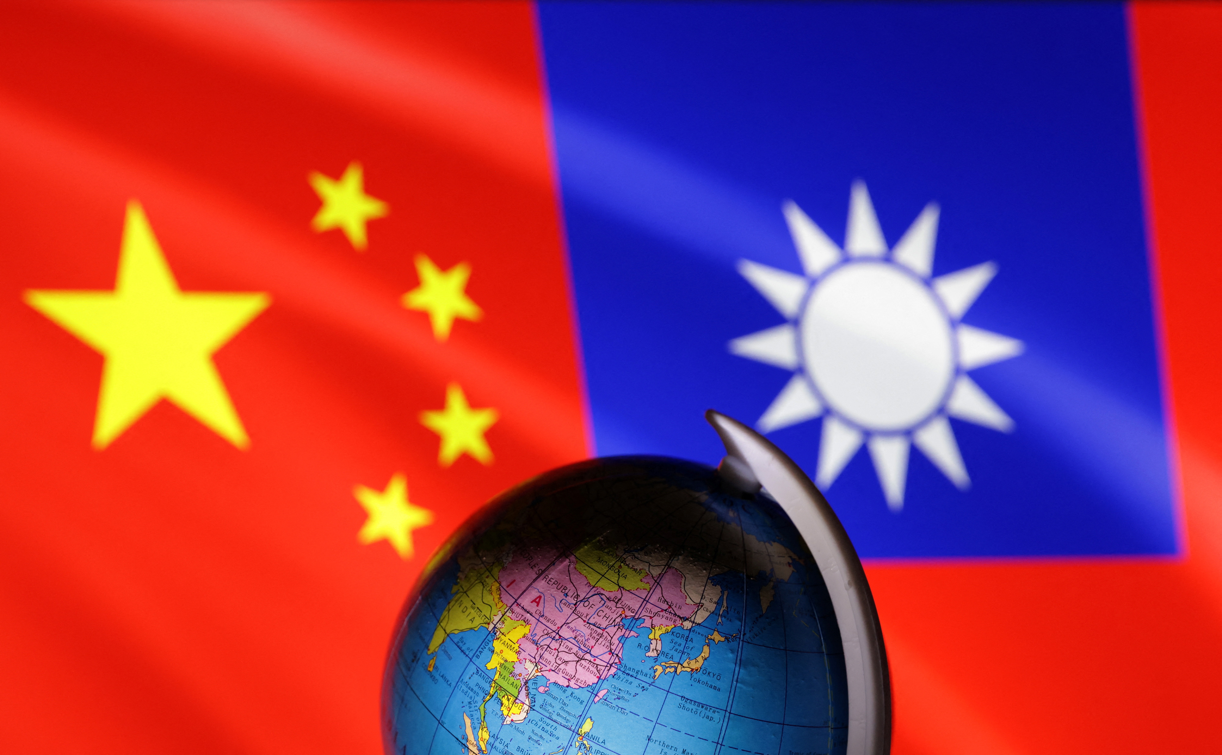 Illustration shows Globe, Chinese and Taiwanese flags
