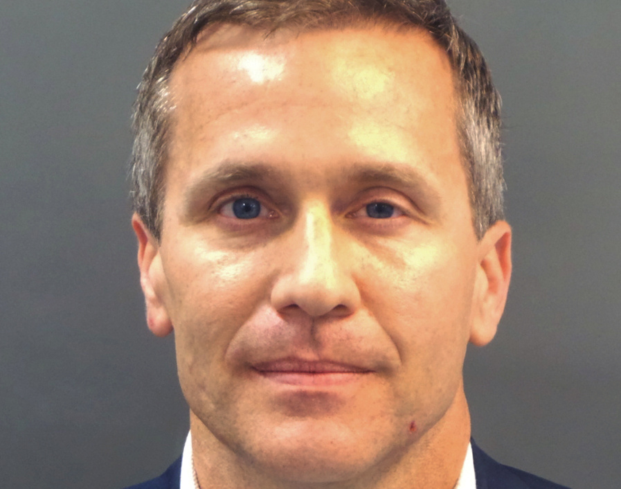 Missouri Governor Eric Greitens appears in a police booking photo in St. Louis