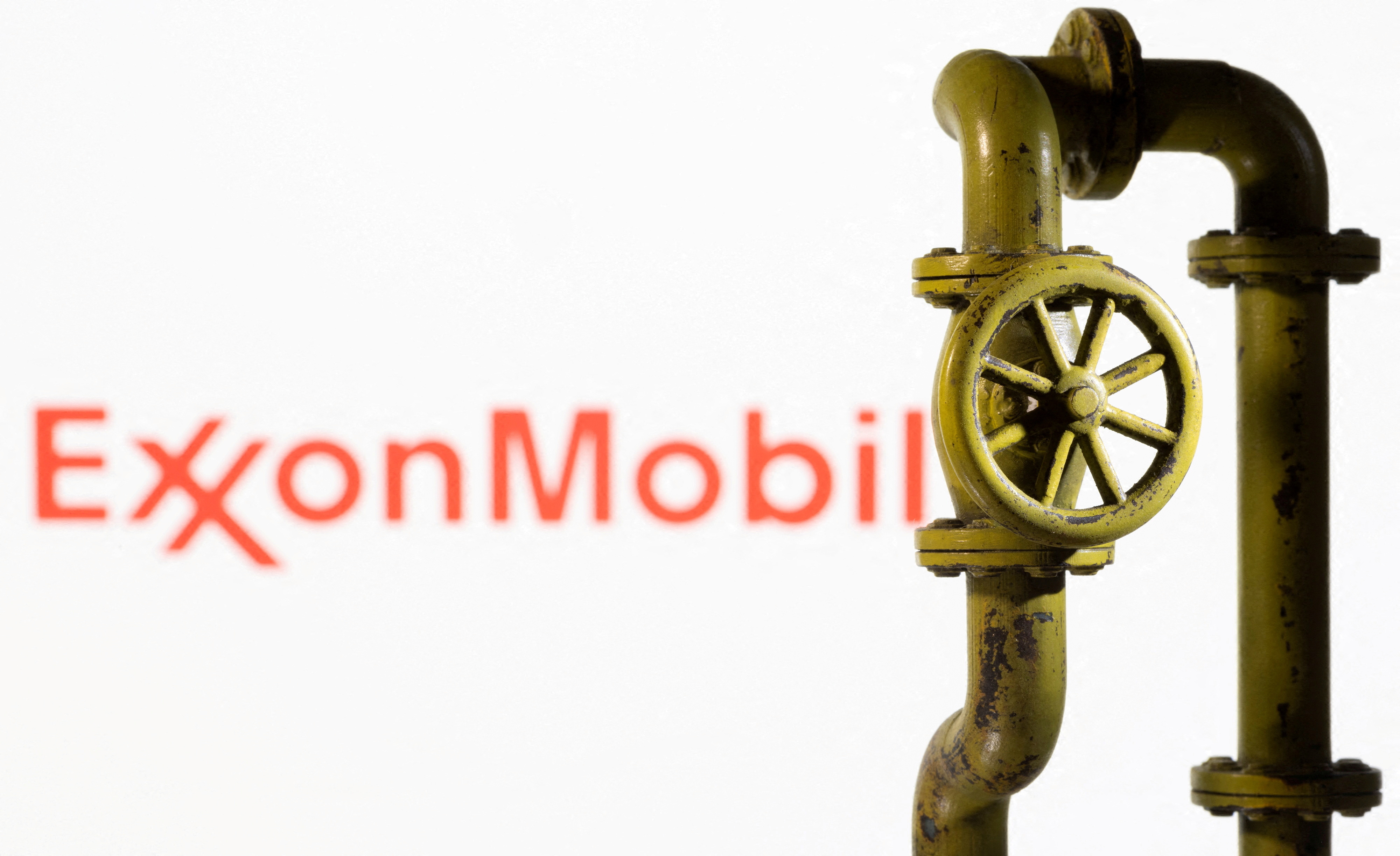 Illustration shows ExxonMobil logo and natural gas pipeline