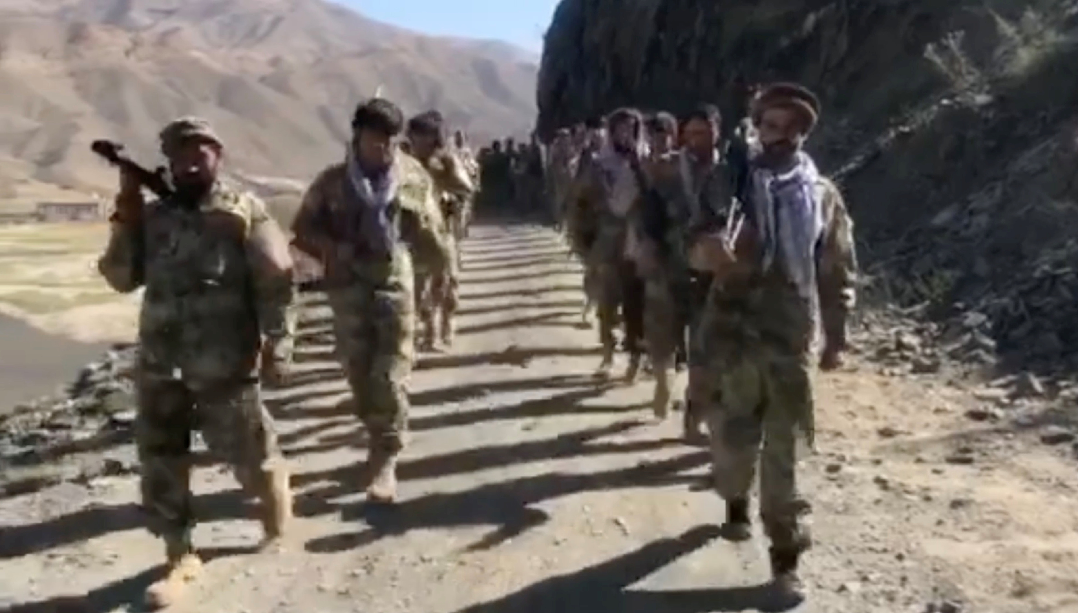 Anti-Taliban resistance troops walk in Panjshir Valley