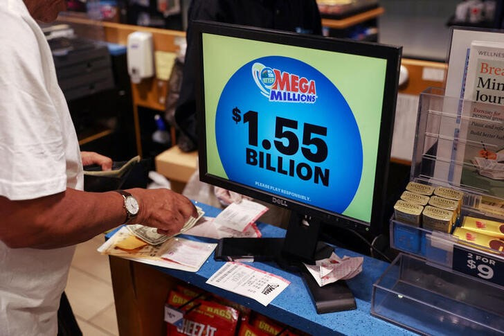 The display in a store shows the Mega Millions lottery jackpot at $1.55-billion